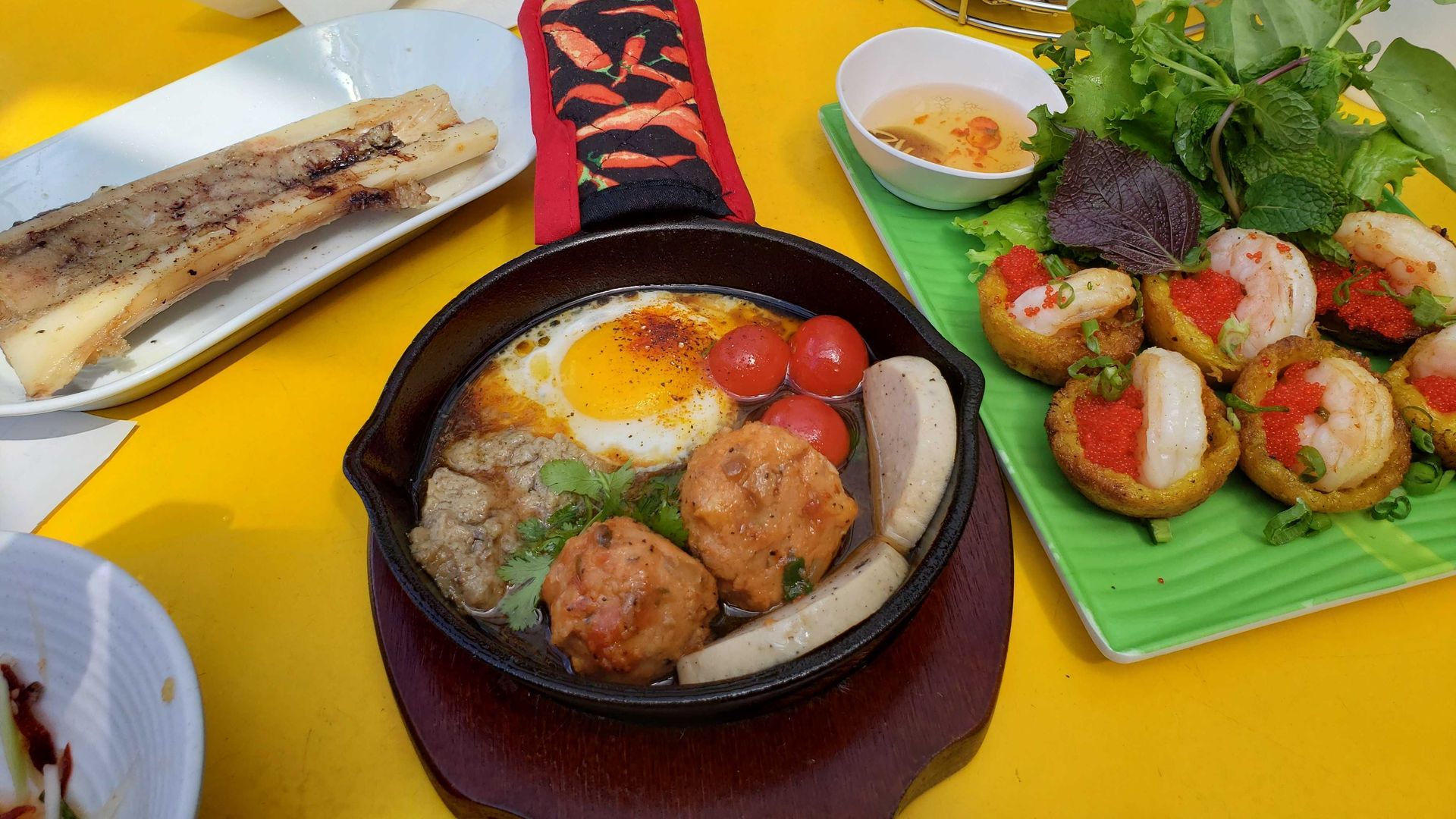 Photo of a pan of meatballs on a table. 