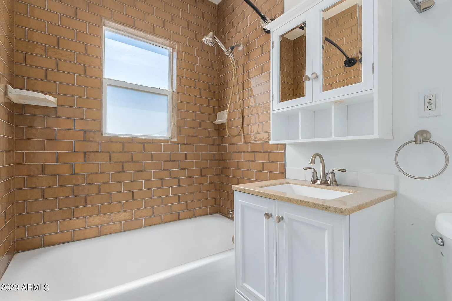 A brick bathroom. 