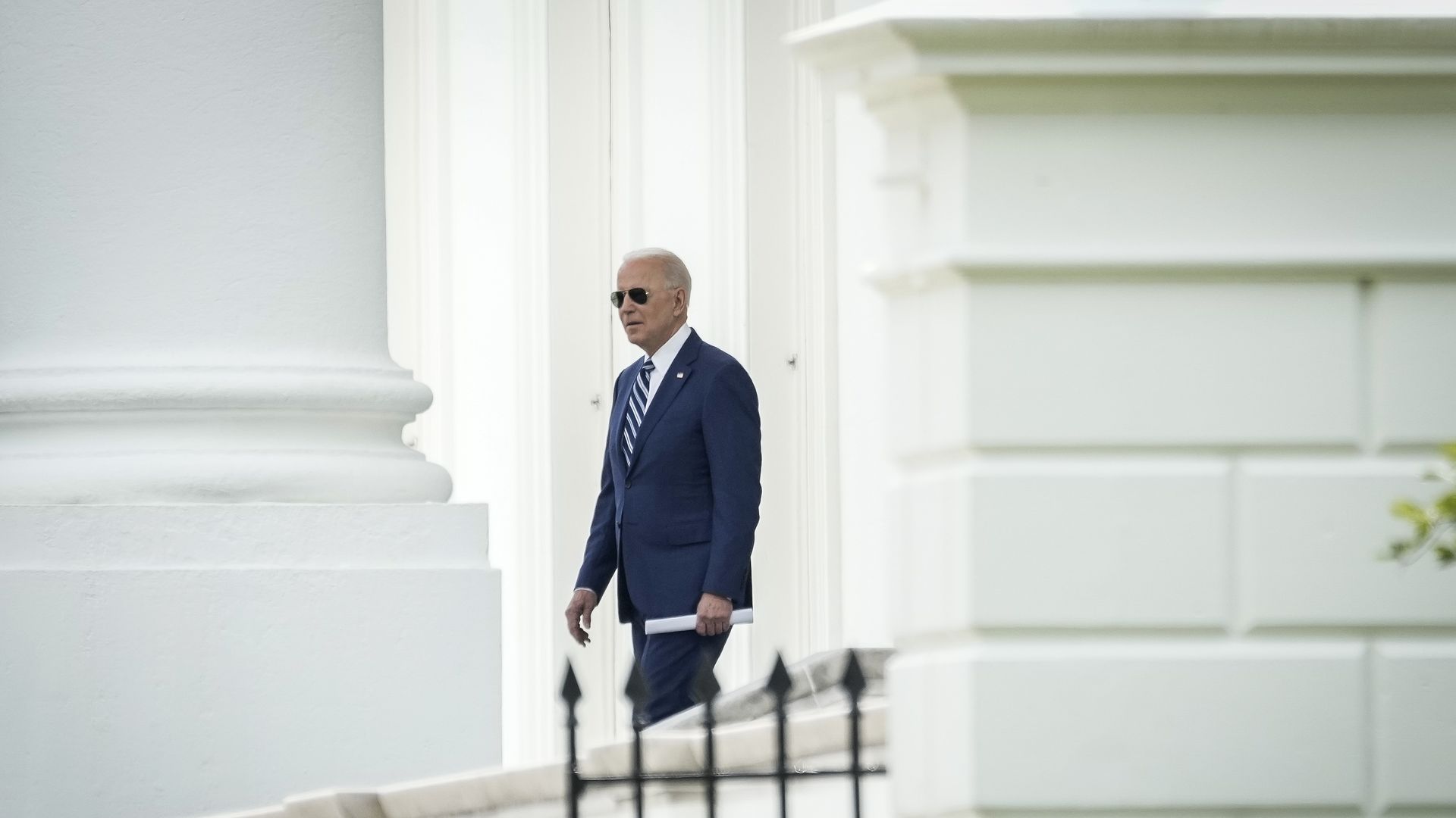 Biden walks out of the White House
