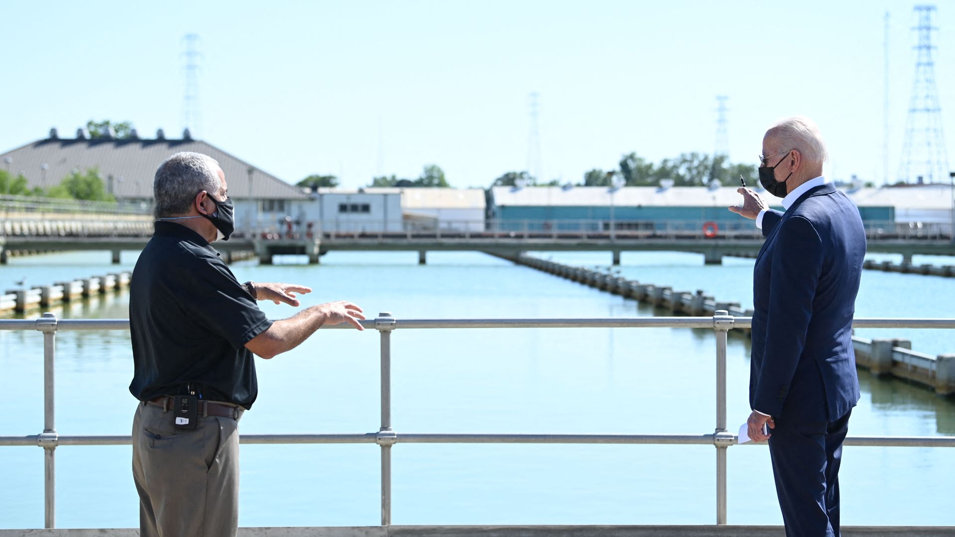 President Biden is seen looking out at a flood management system during a visit to Louisiana.