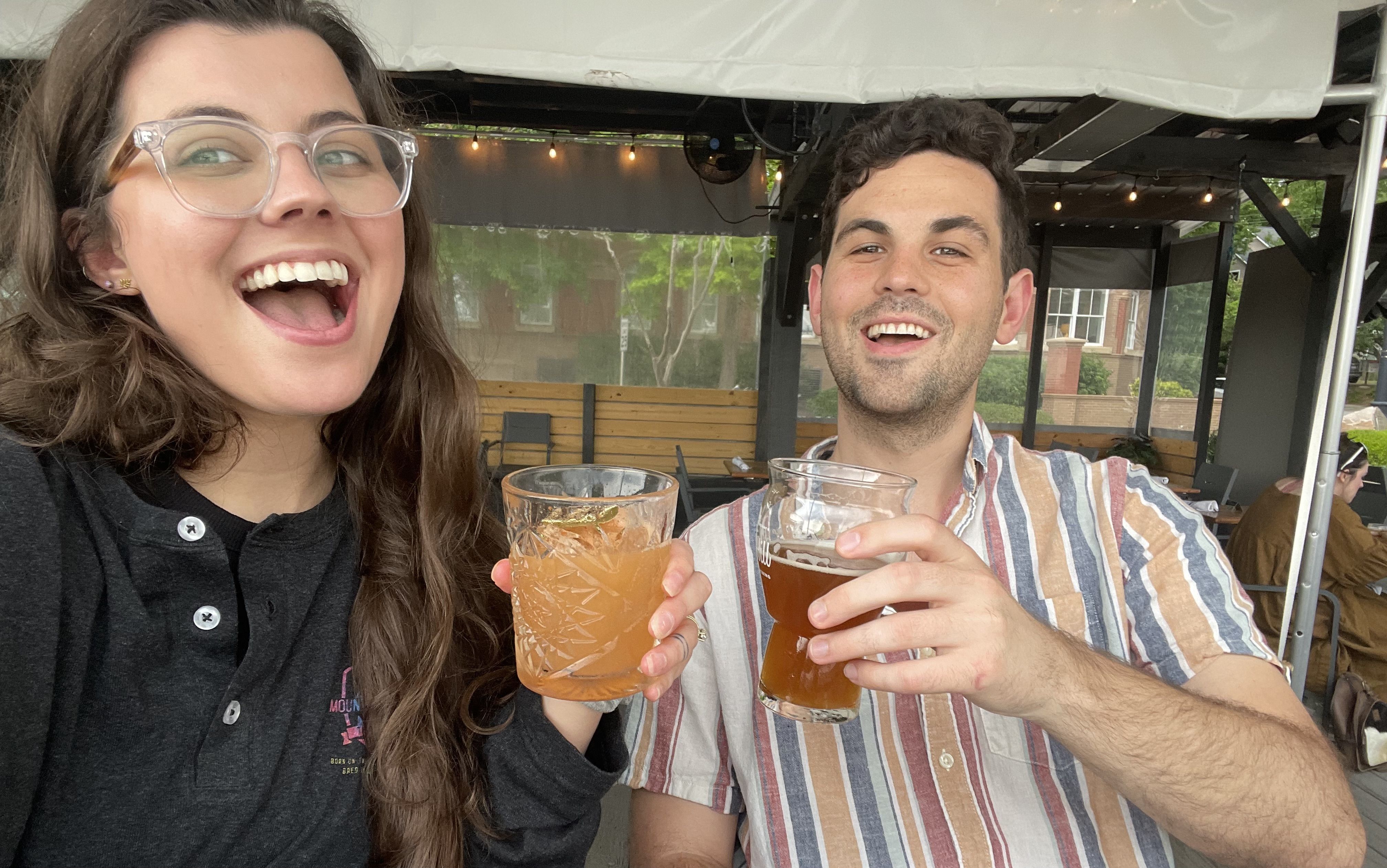 Lucille and Zach drinking cocktails at Wye Hill, circa 2022. 