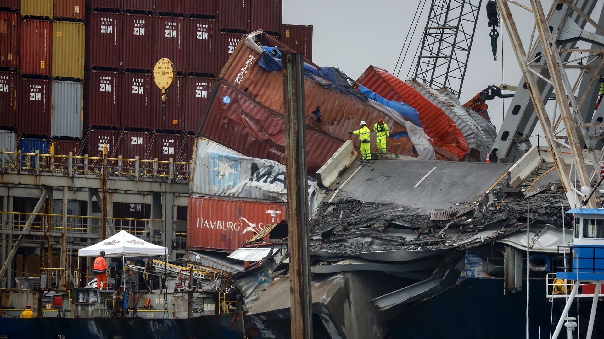 Salvage crew members work on the deck of the cargo ship Dali as they work to free it in the Patapsco River on May 10 in Baltimore.