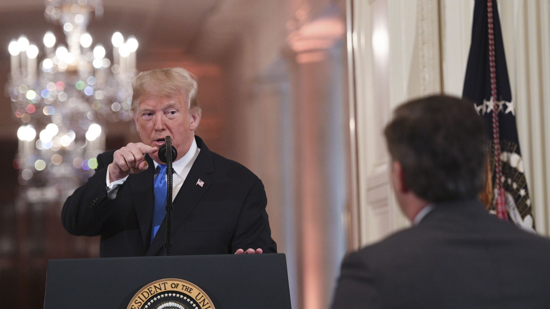 Donald Trump pointing at Jim Acosta.
