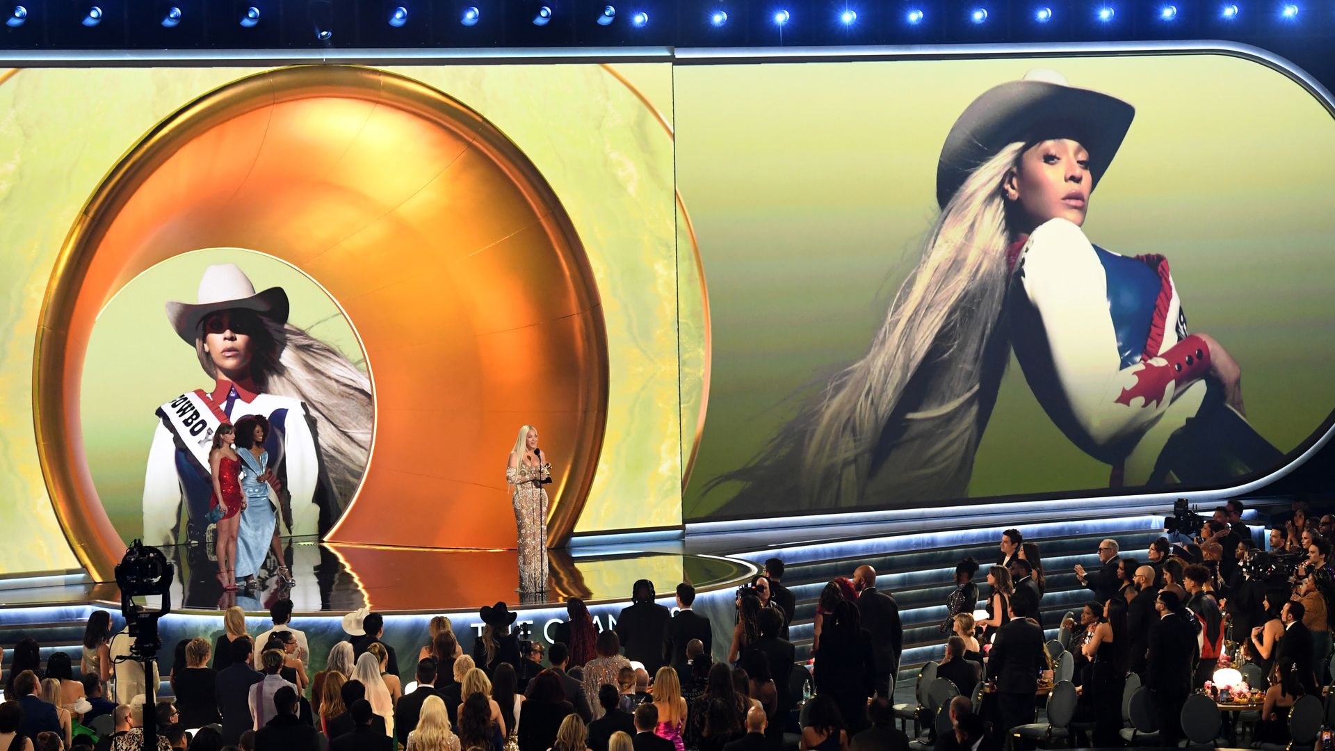 A crowd watches a Beyonce on stage at the Grammys. 