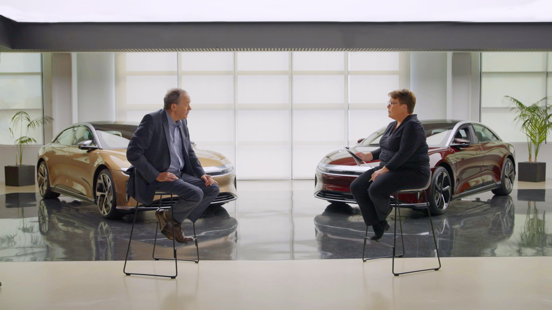 Image of Lucid Motors CEO Peter Rawlinson, left, being interviewed by Joann Muller on "Axios on HBO."