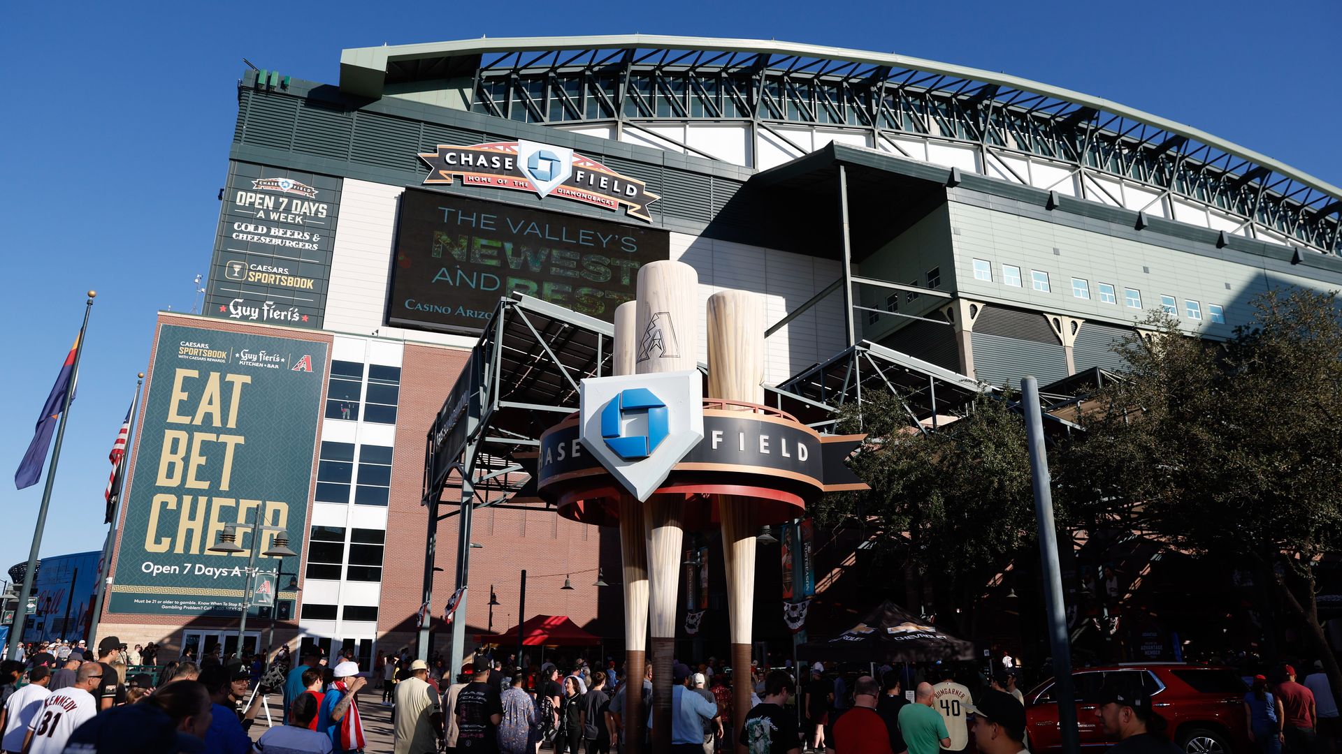 The exterior of Chase Field, with fans filing into the ballpark. 
