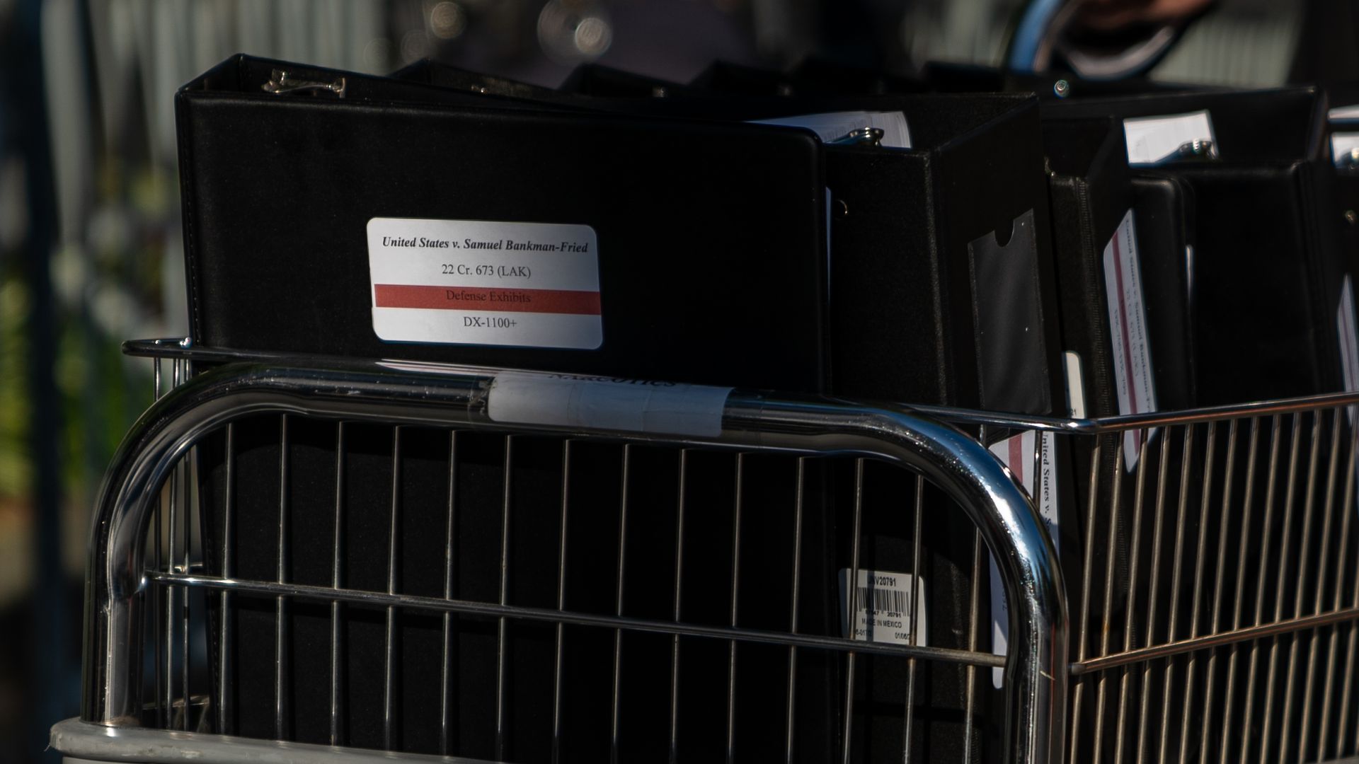 A cart with binders marked for the Sam Bankman-Fried criminal trial.