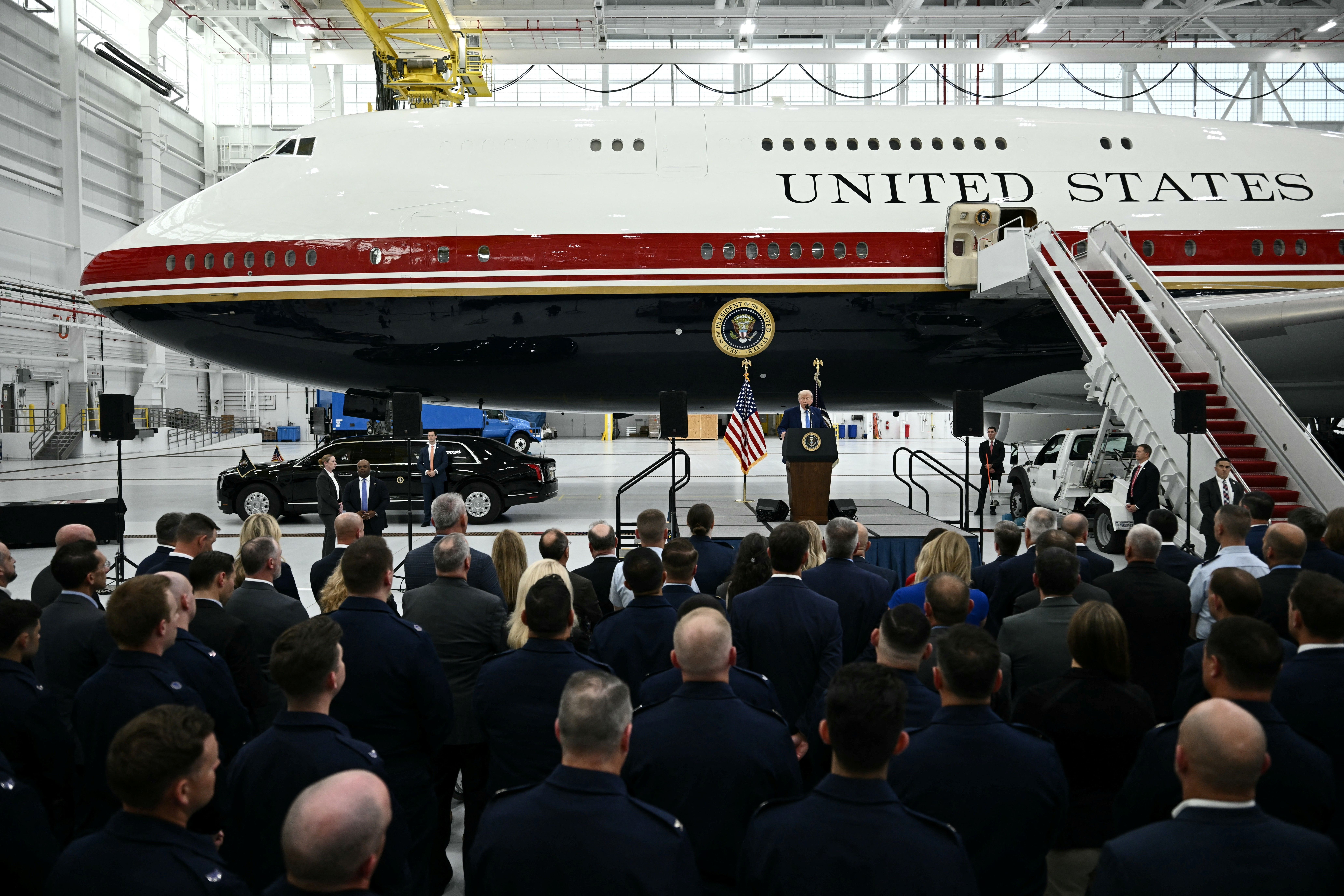 Trump at a podium in front of an audience