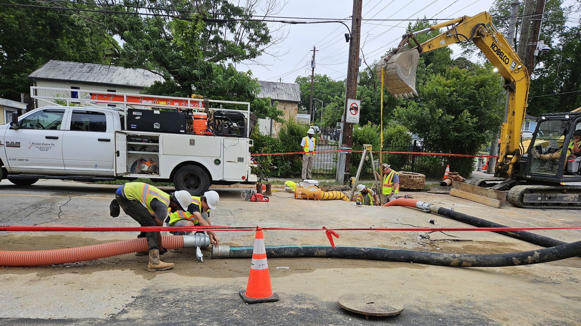 Department of Watershed Management crews work to repair the water main break in Vine City.
