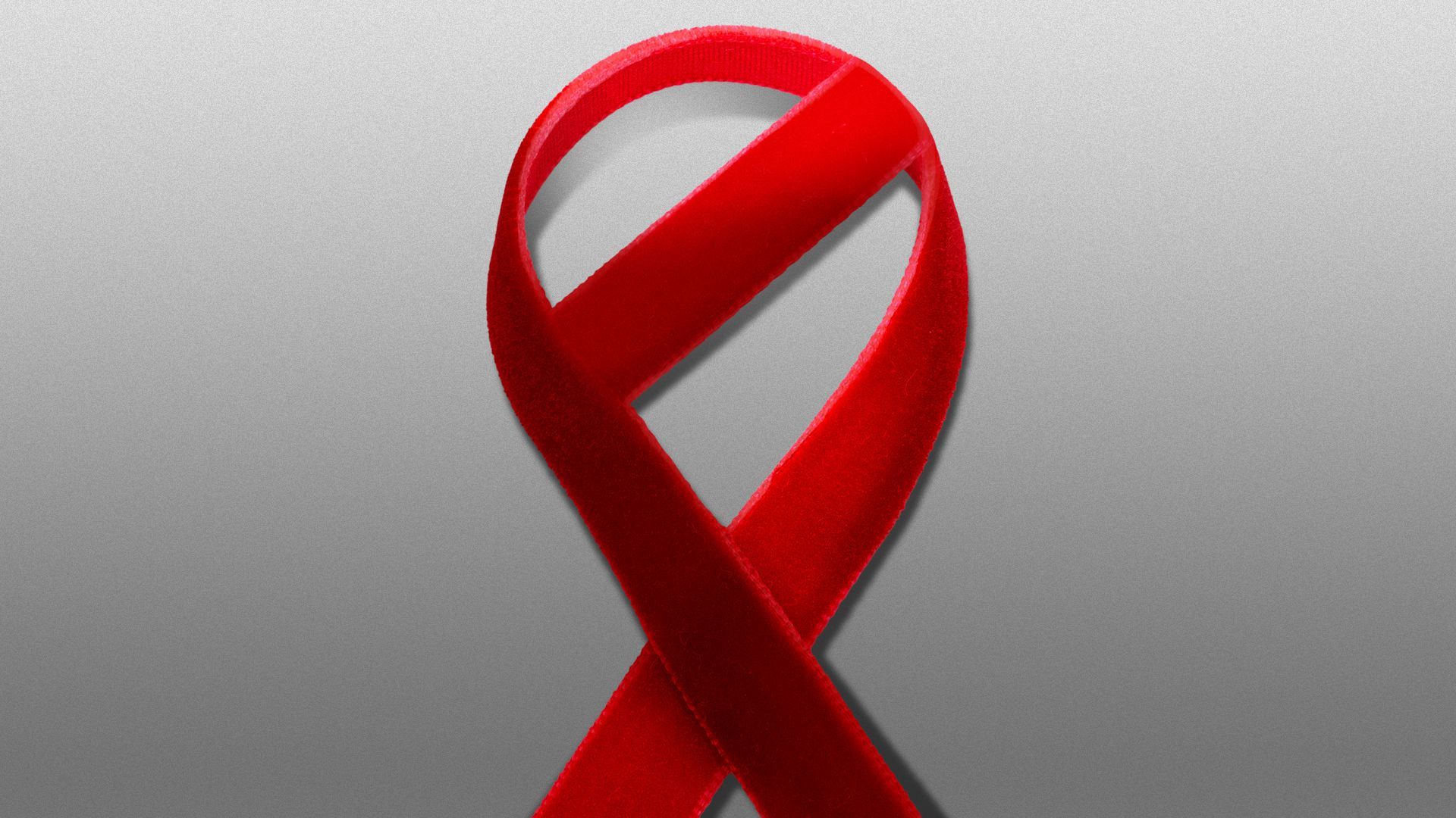 Illustration of a red AIDS awareness ribbon shaped like a "no" sign 