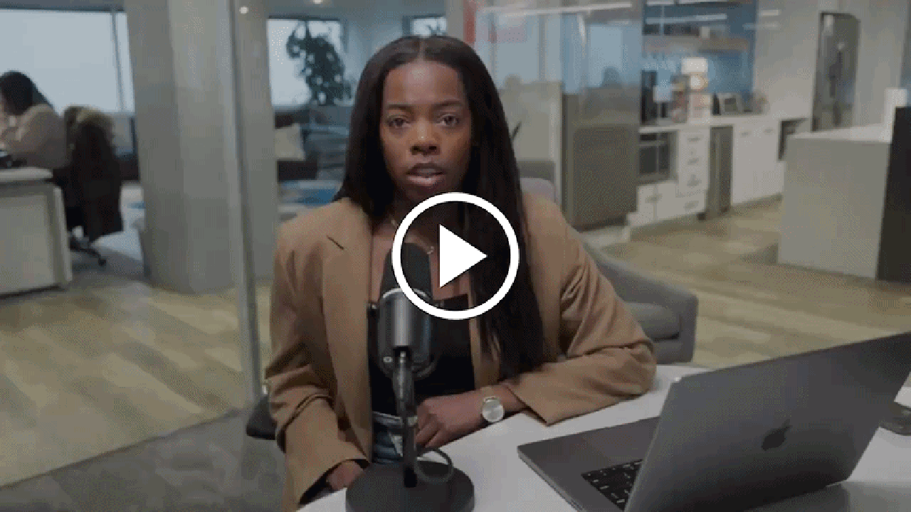 Woman speaking to camera in an office