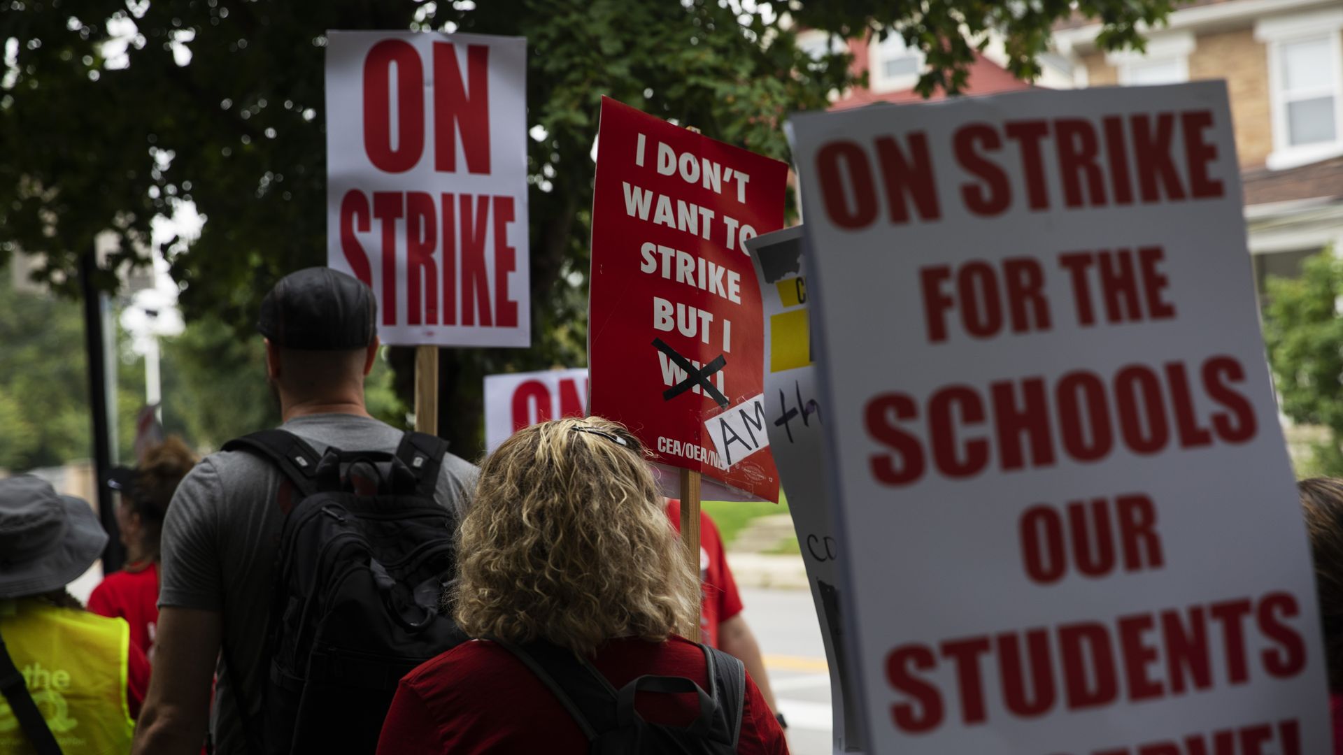 Striking Columbus teachers on the picket line with signs.