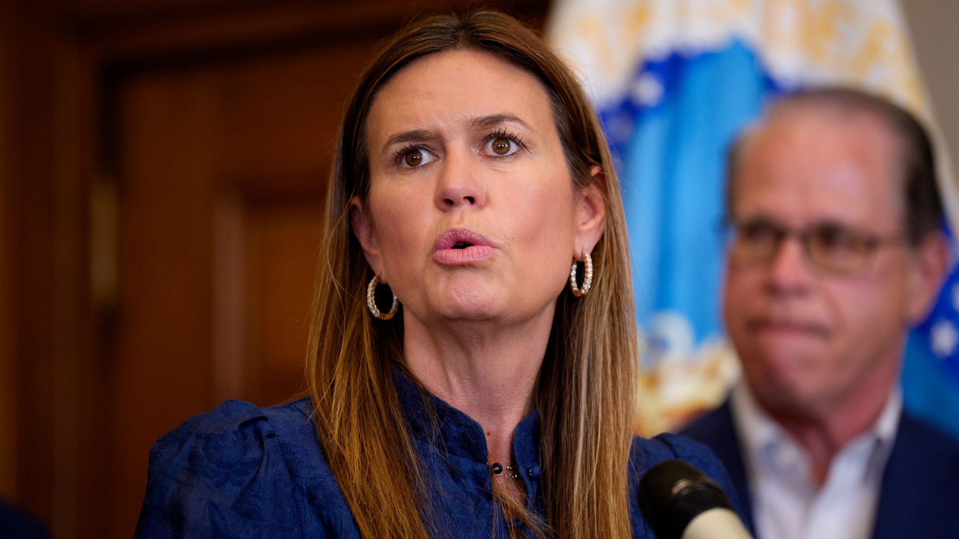 Arkansas Gov. Sarah Huckabee Sanders speaks before U.S. Agriculture Secretary Brooke Rollins signs three new SNAP food choice waivers for the states of Idaho, Utah, and Arkansas in her office at the United States Department of Agriculture Whitten Building on June 10, 2025 in Washington, DC.