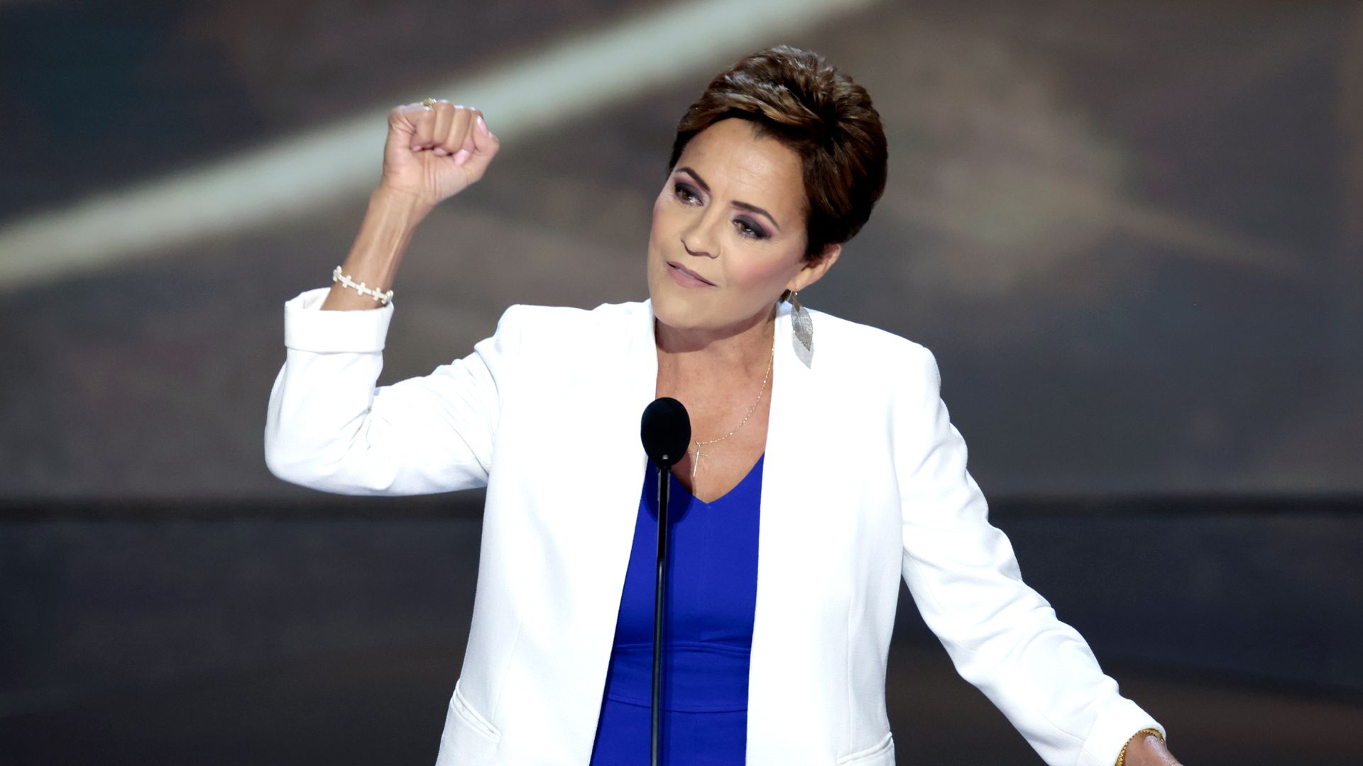 A woman at a podium. 