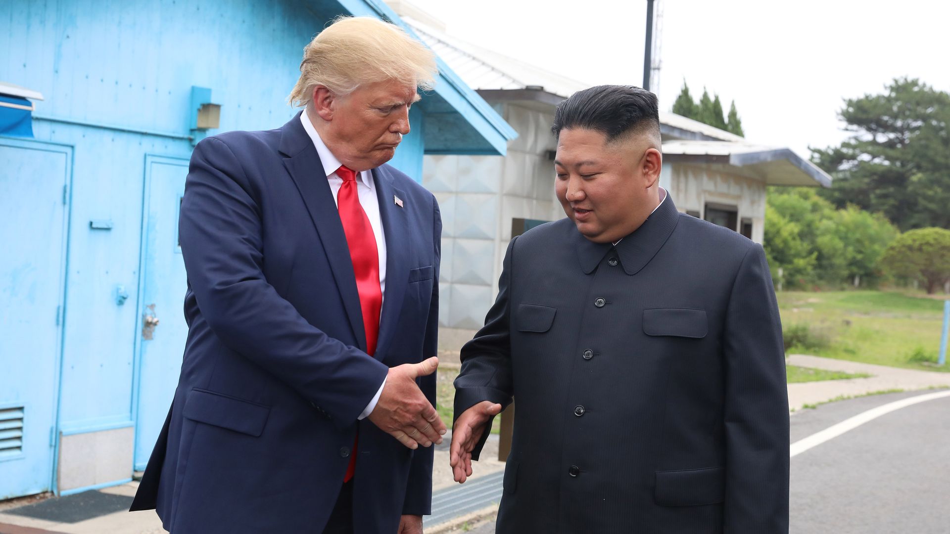 Trump shaking Kim's hand in the demilitarized zone
