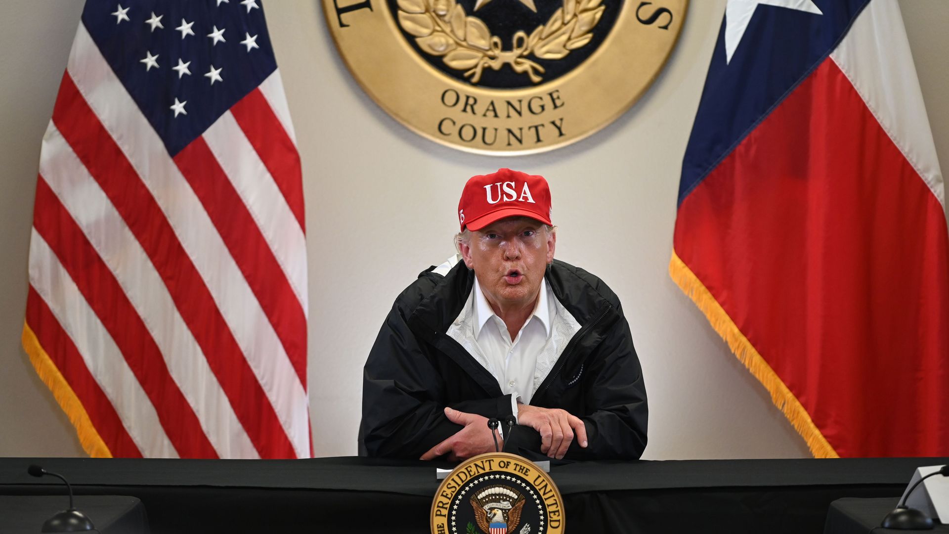 President Trump attends a briefing at an emergency operation center in Orange, Texas, on August 29