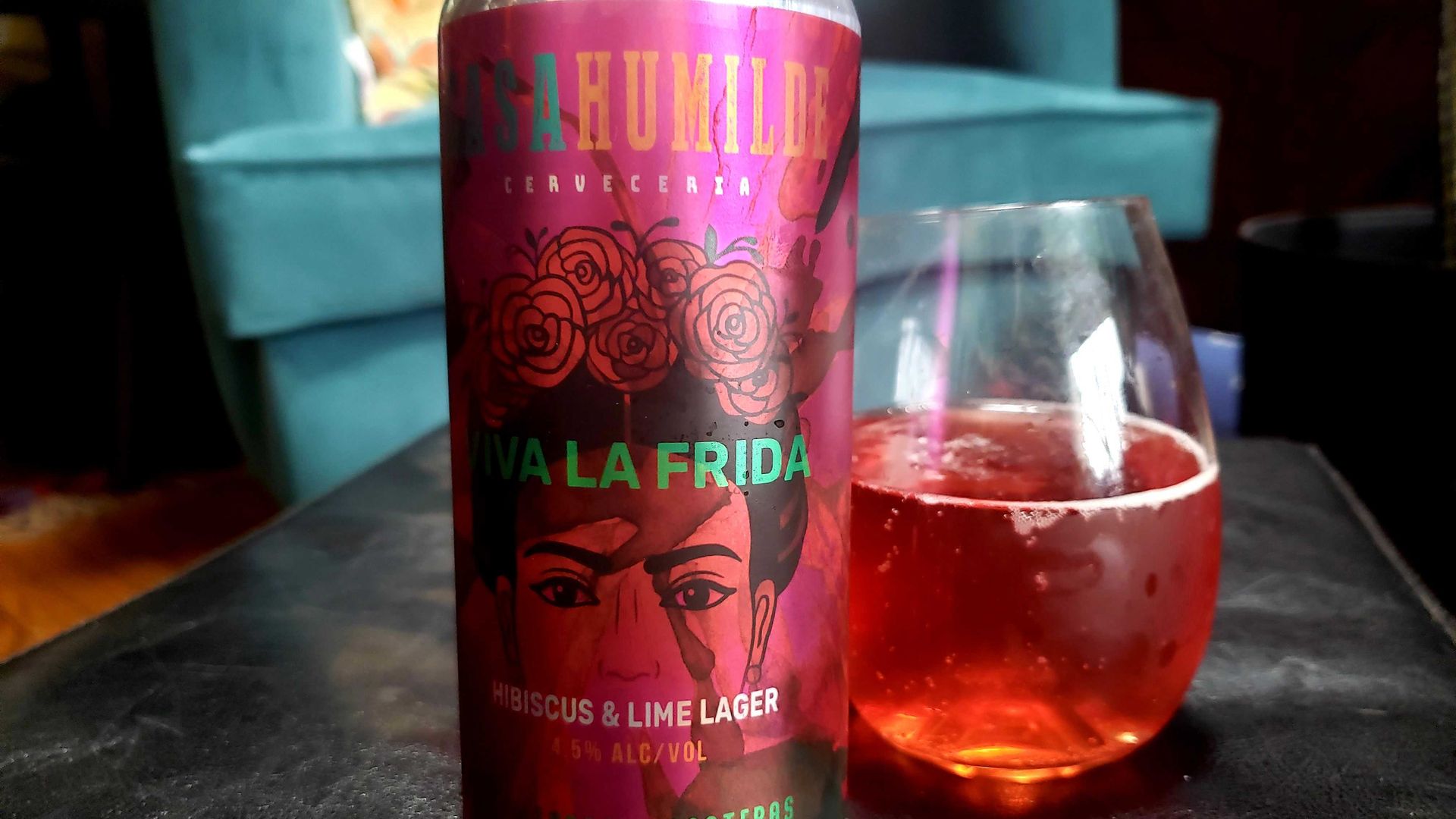 Photo of a can of beer, with liquid in a glass next to it. 