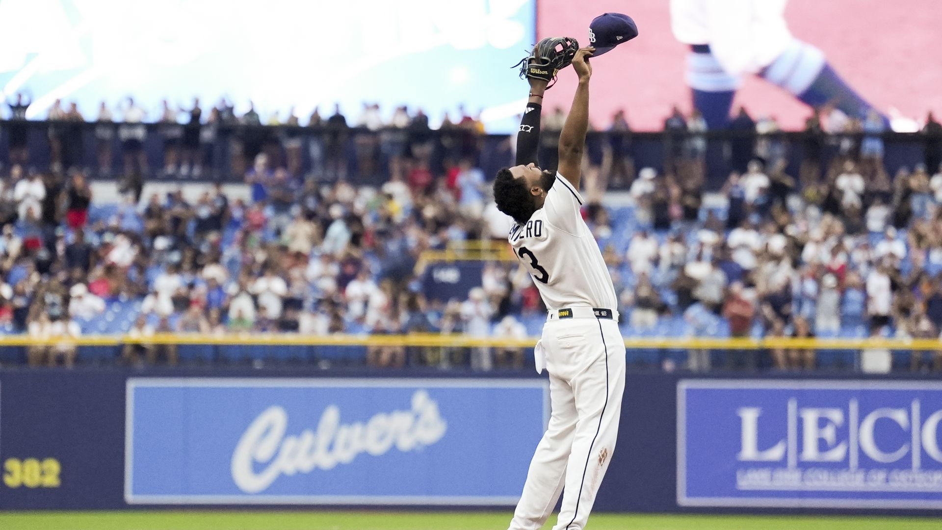 Junior Caminero #13 of the Tampa Bay Rays celebrates by pointing to the sky with both arms after the Rays defeated the Boston Red Sox at Tropicana Field on Sunday, September 20, 2026 in St. Petersburg, Florida.