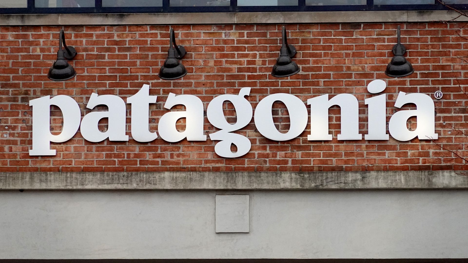 A sign hangs in front of a Patagonia store on October 29, 2021 in Chicago, Illinois. 