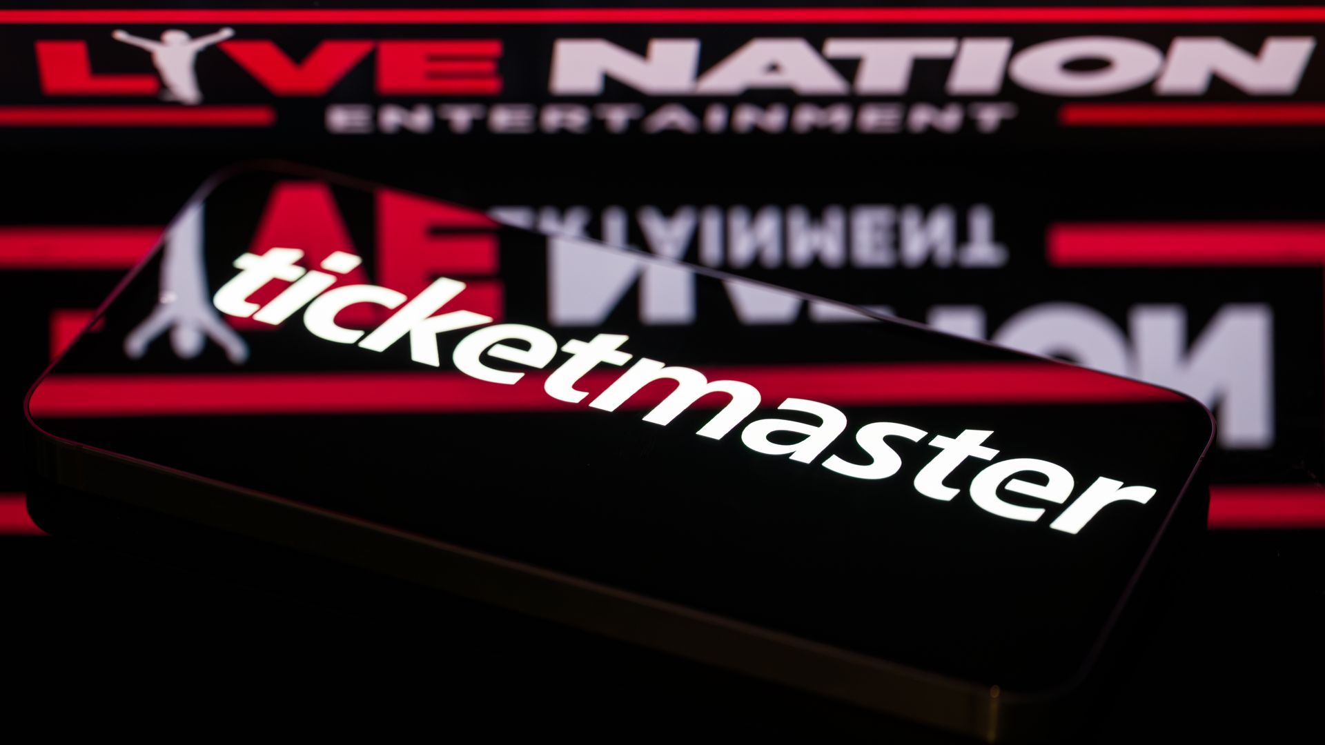 The Ticketmaster logo is displayed on a smartphone screen in this photo illustration. Ticketmaster's parent company, Live Nation Entertainment, currently faces a major antitrust trial in the United States, where regulators accuse the live-events giant of monopolizing the concert ticketing and promot