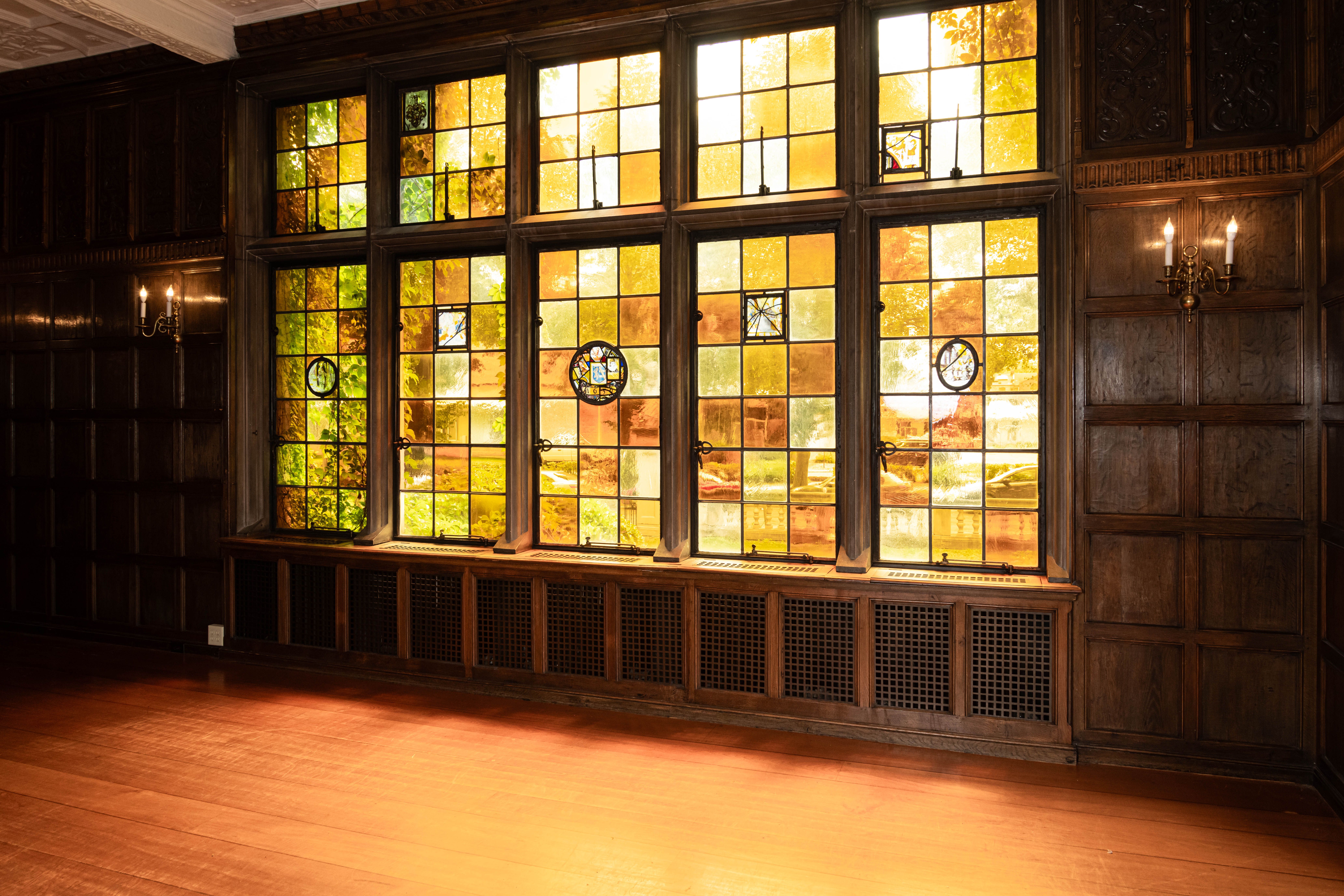 Windows with orange and yellow stained glass.