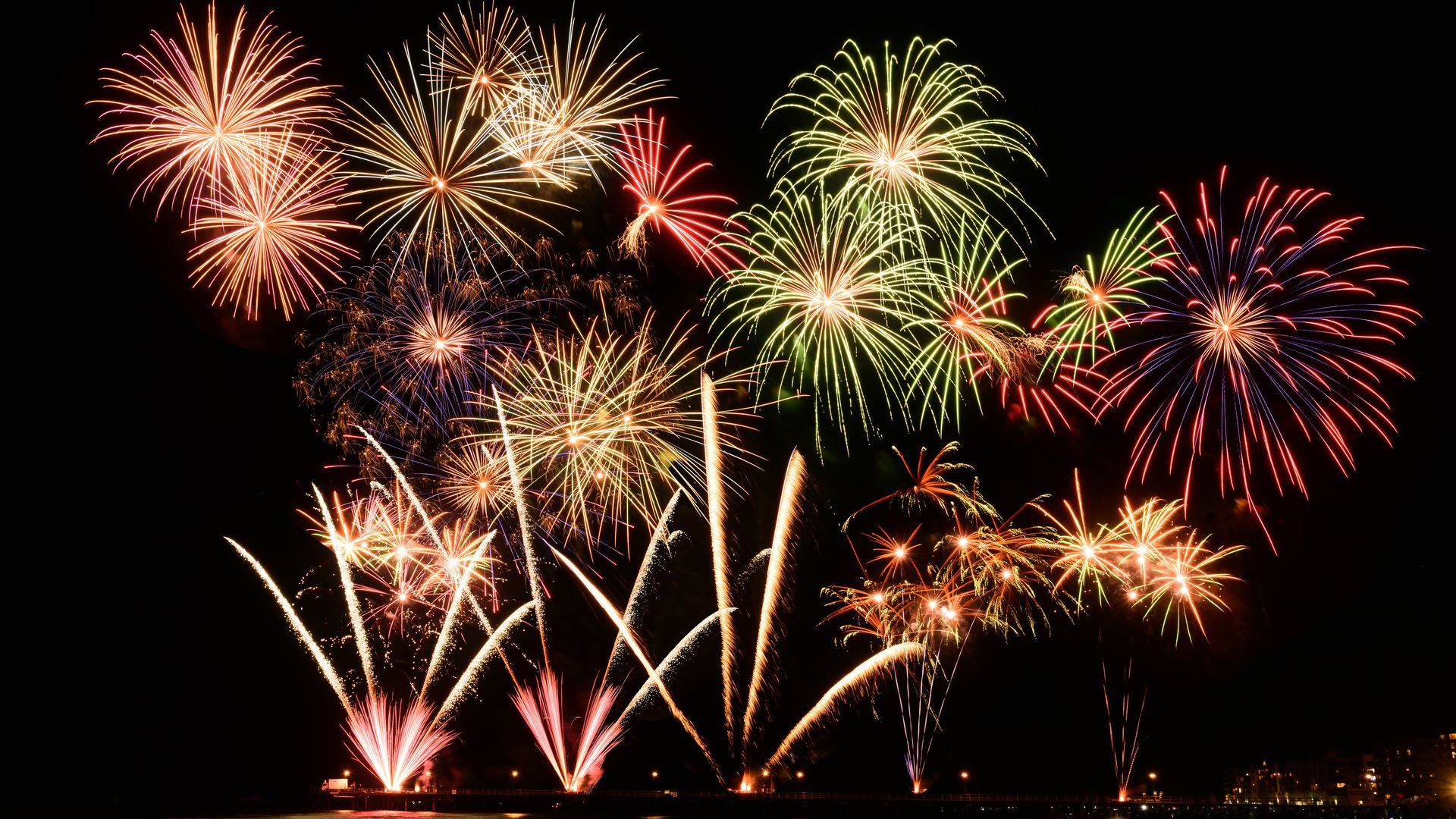 Red, orange, yellow and green fireworks.