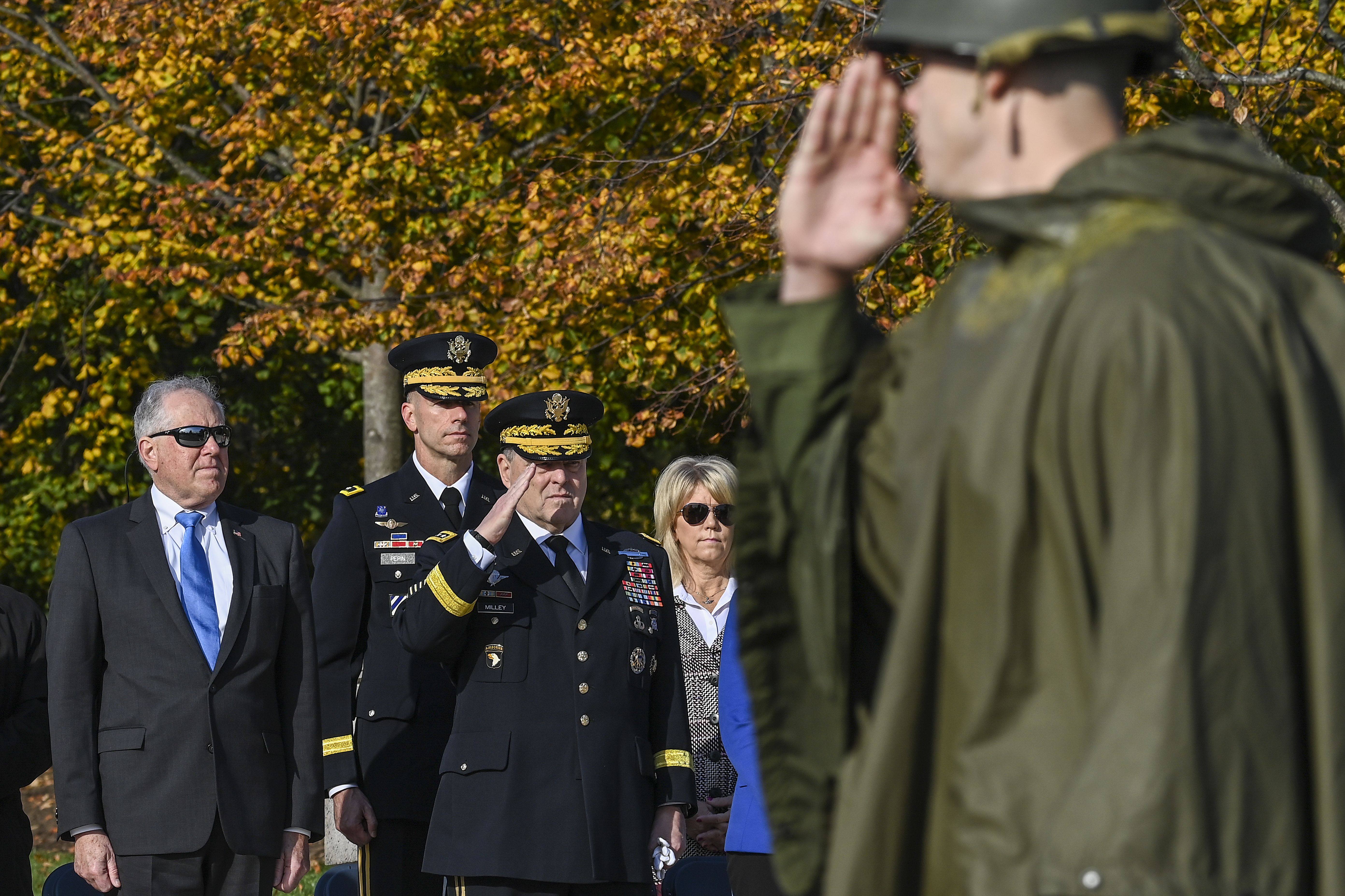 Chairman of the Joint Chiefs of Staff Gen. Mark Milley saluting service members during the centennial anniversary of the Tomb of the Unknown Soldier at Arlington National Cemetery on Nov. 11, 2021.