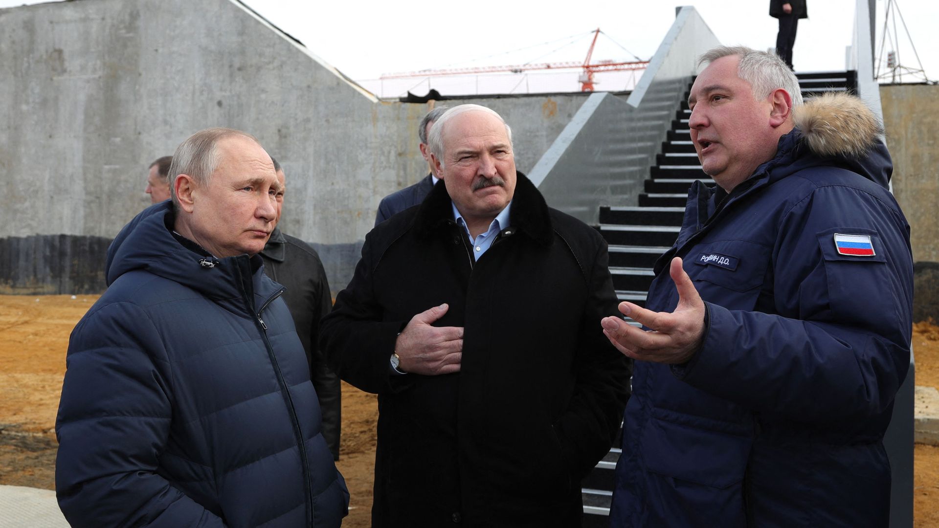 Roscosmos chief Dmitry Rogozin (R) gives explanations to Russia's President Vladimir Putin (L) and Belarus President Alexander Lukashenko (C) during their visit at the Vostochny cosmodrome.