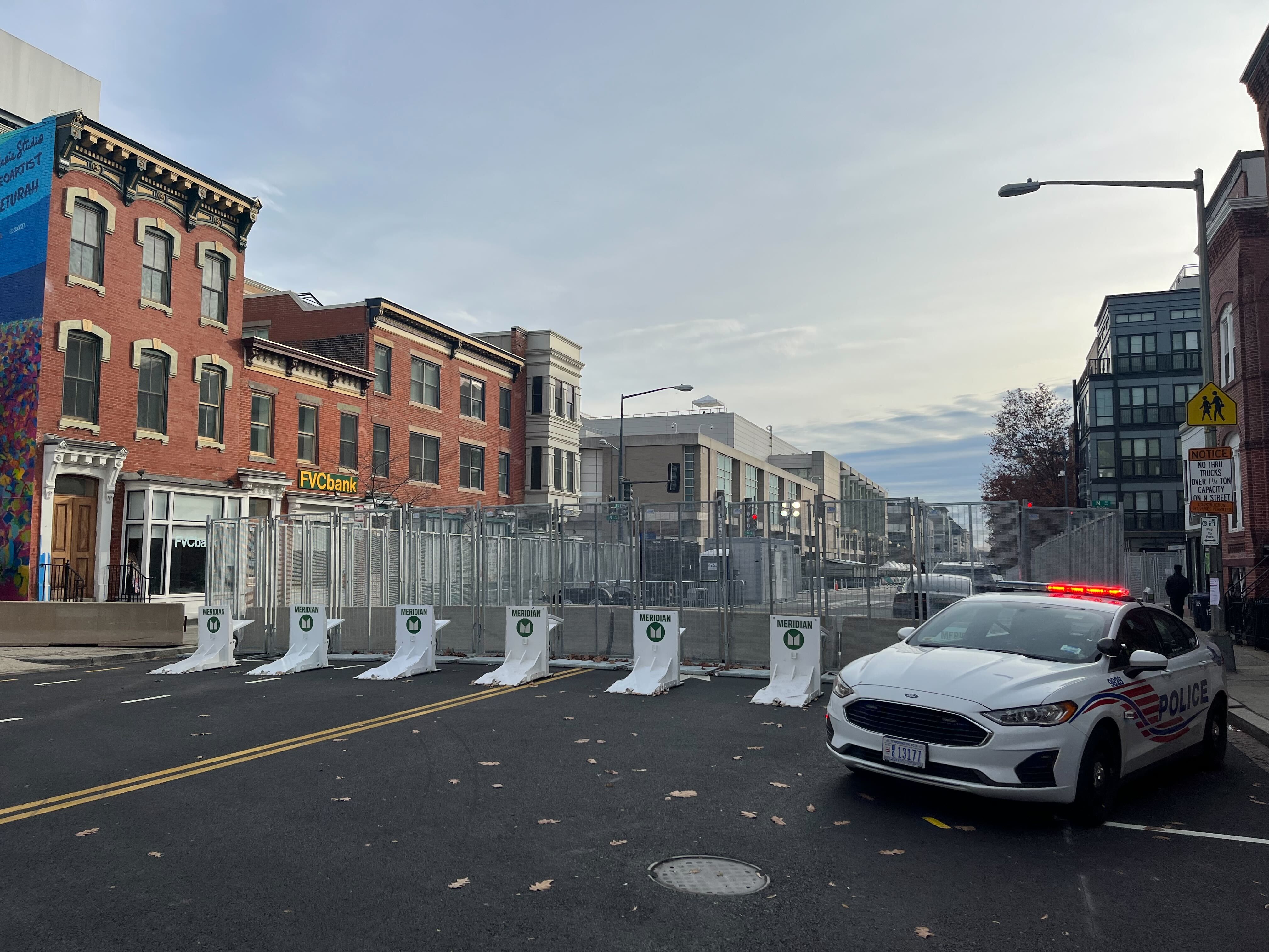 Street shut down with fence barricade leading to convention center