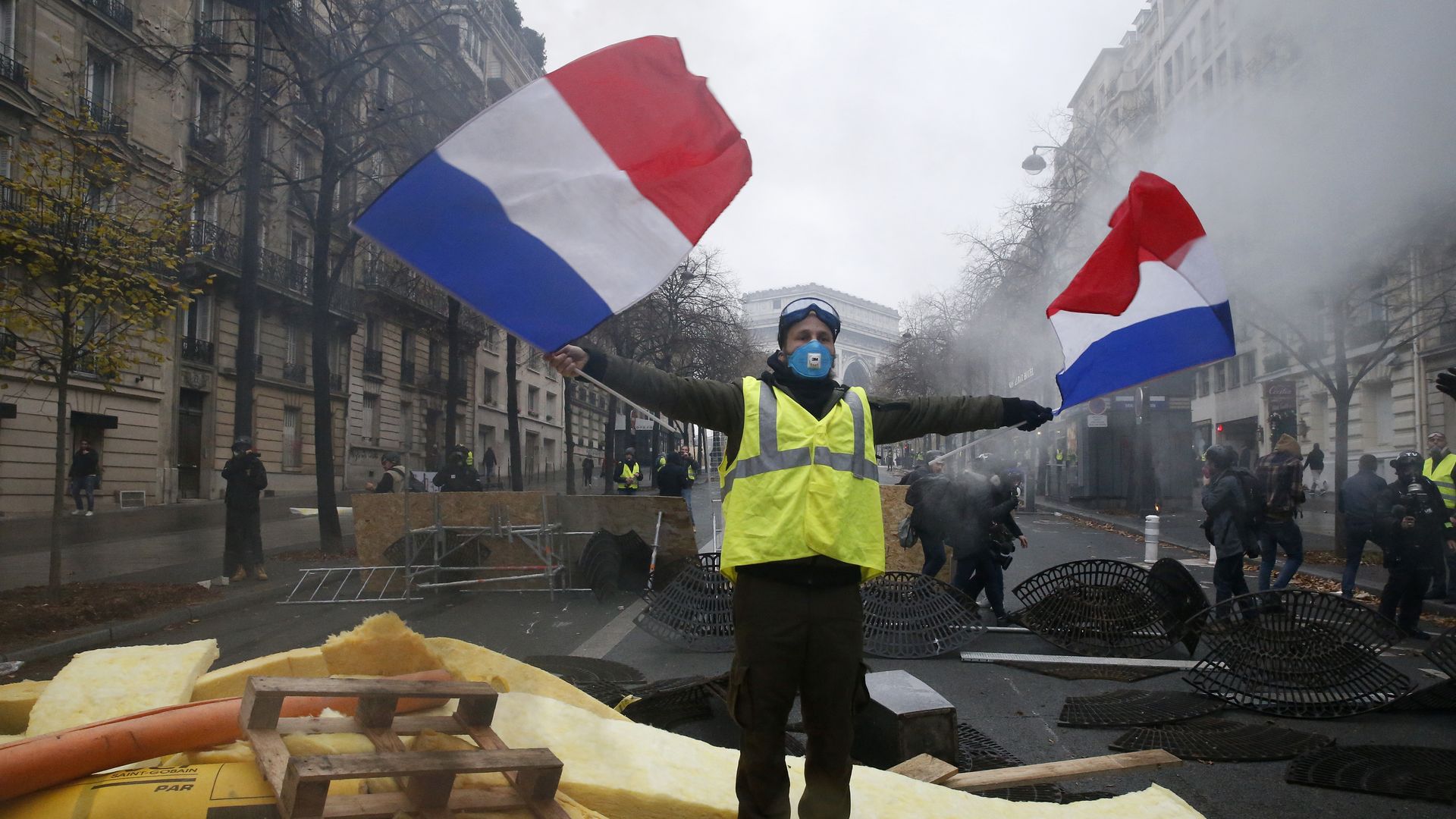 Protestor waves French flags