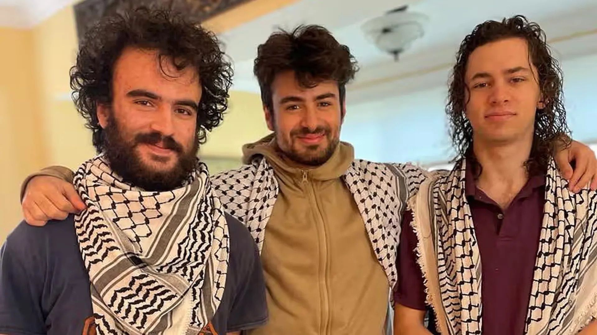 Photo of, from left, Hisham Awartani, Tahseen Ahmad and Kinnan Abdalhamid, smiling and with their arms around one another. They were shot in Burlington, Vt., on Saturday night. 