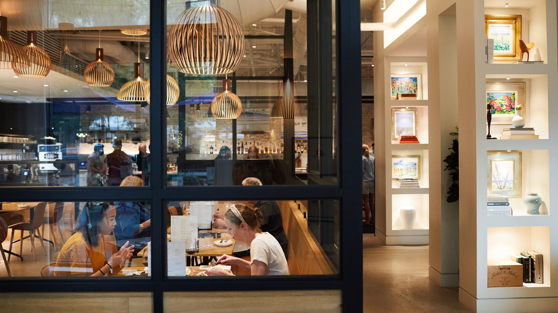 Diners eat inside the dining room of the The Duck and the Peach