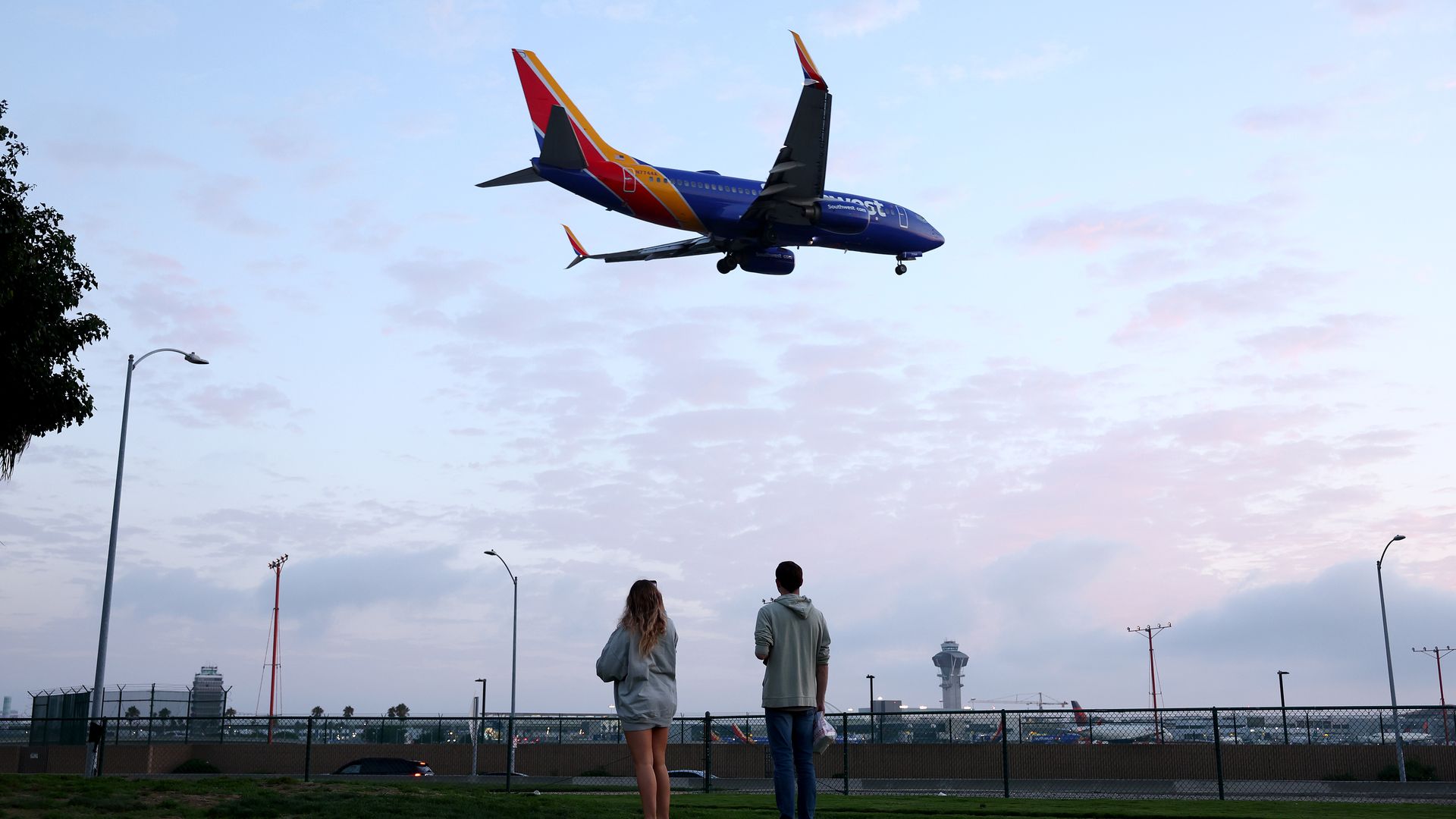 Onlookers watch as a Southwest Airlines flight lands at Los Angeles International Airport on August 31, 2023. Photo: Mario Tama/Getty Images