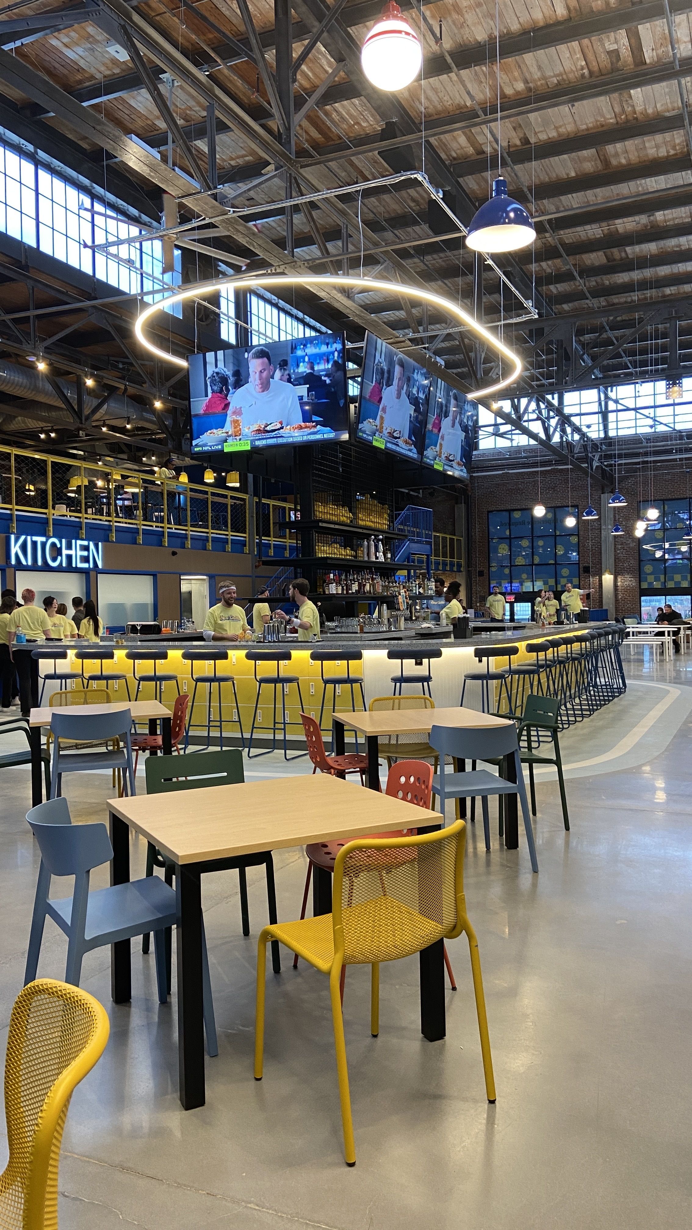 The view of the bar and TVs at Tipsy Pickle. 