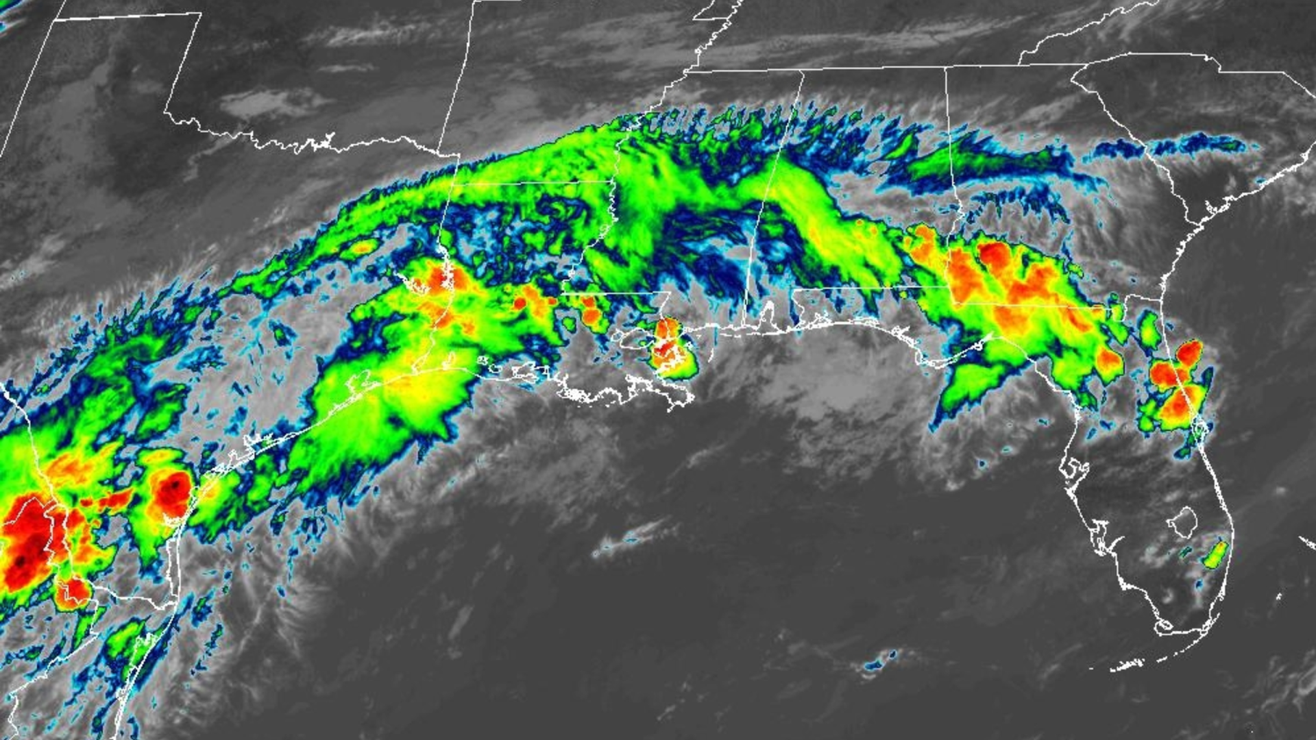 Satellite radar image shows a long line of storms from Texas to Florida along the Gulf Coast, with colors from green to red indicating heavy rain and strong convection.