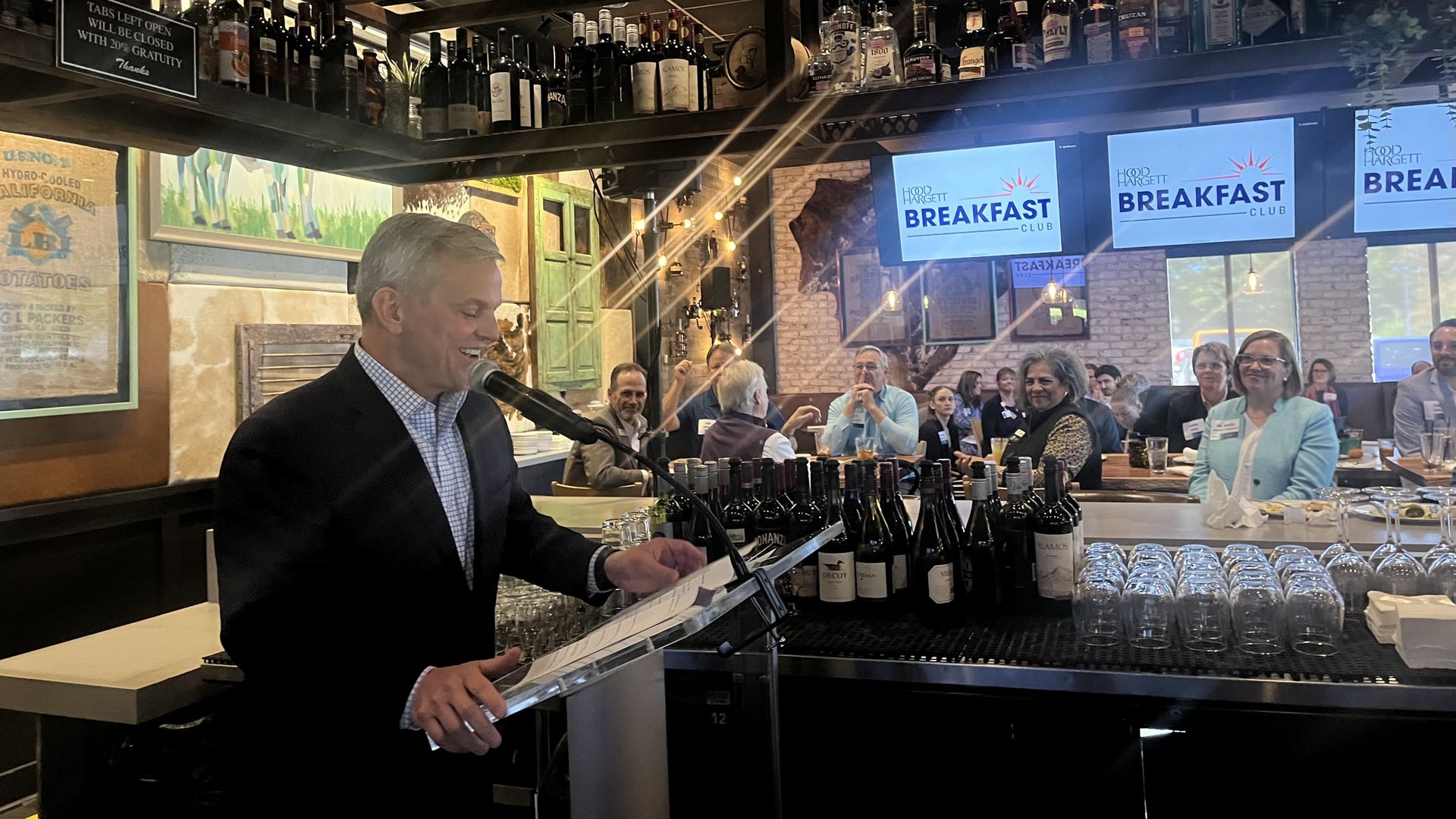 Josh Stein speaks to an audience in a bar
