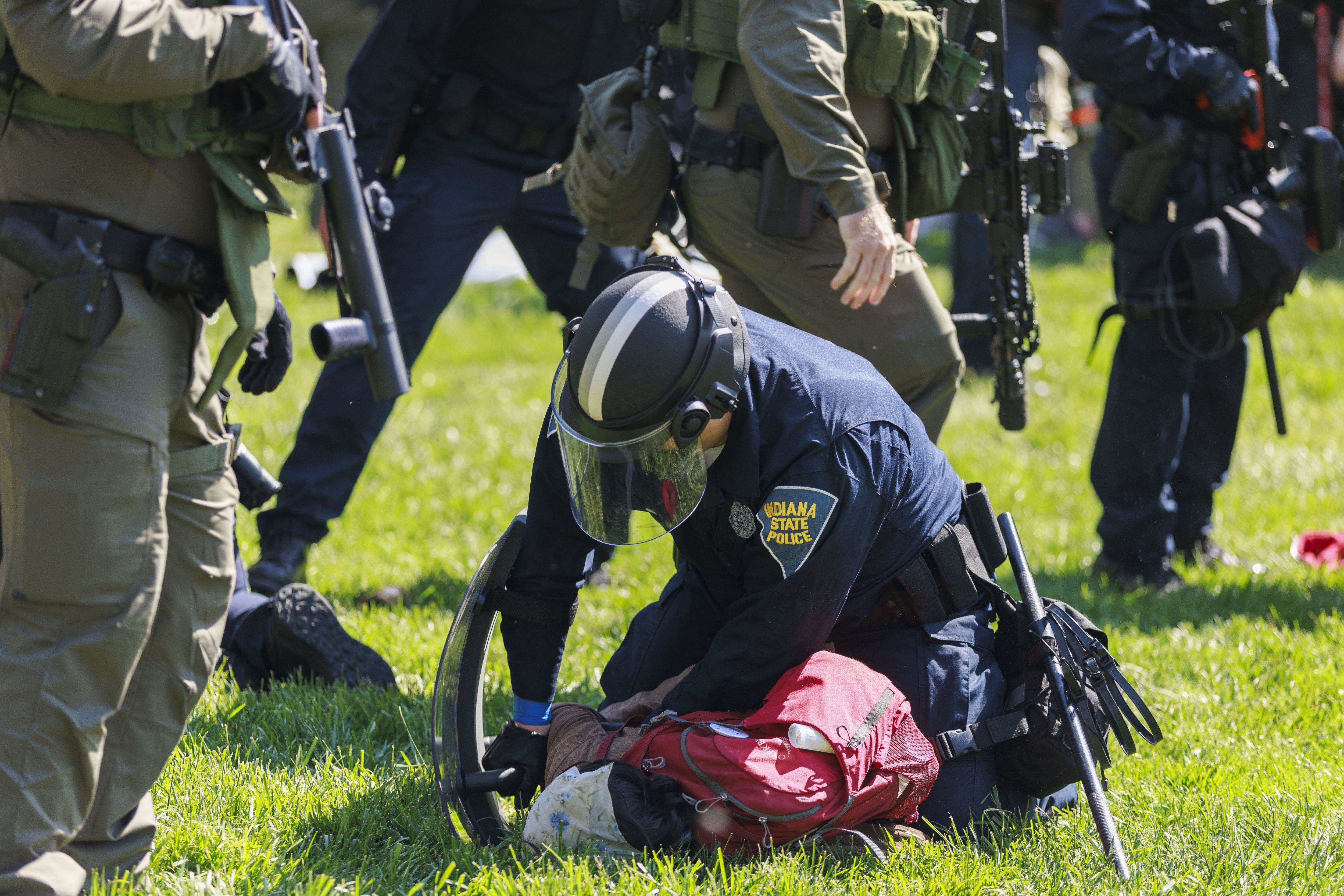 A police officer arresting protestors