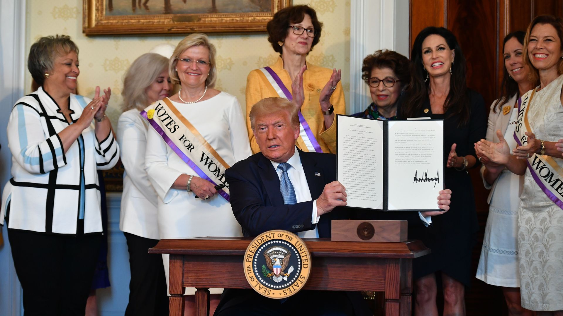 Trump holds up an executive order