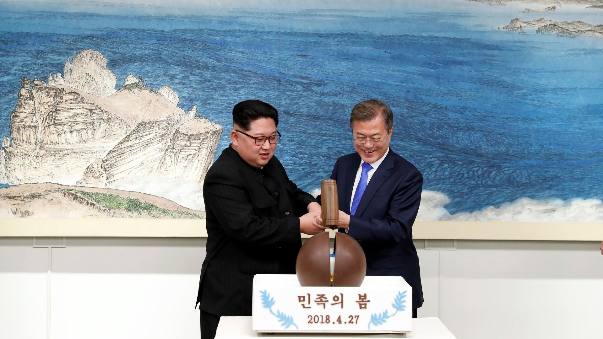 Kim Jong-un and Moon Jae-in take a mallet to a chocolate eggshell dessert