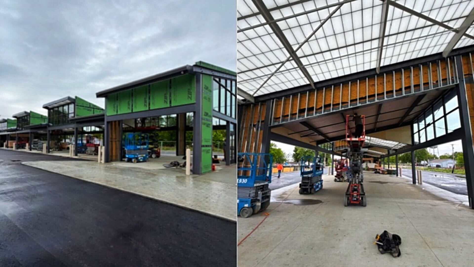 Construction site of a steel-framed building: exterior with green sheathing and large windows; interior shows exposed steel beams and a worker on a lift under a translucent roof.