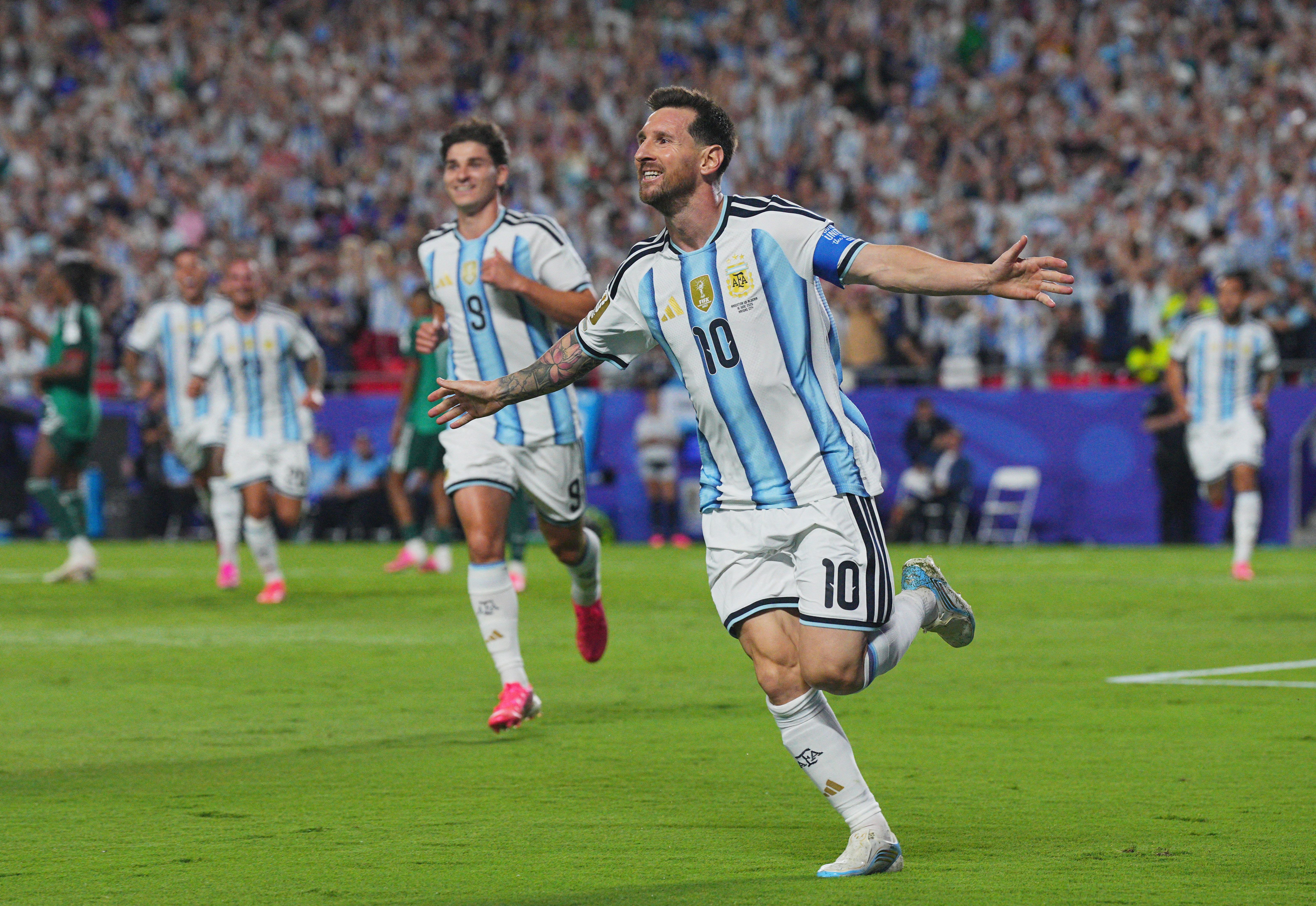 Argentina's Lionel Messi celebrates after scoring against Algeria in Kansas City last night.