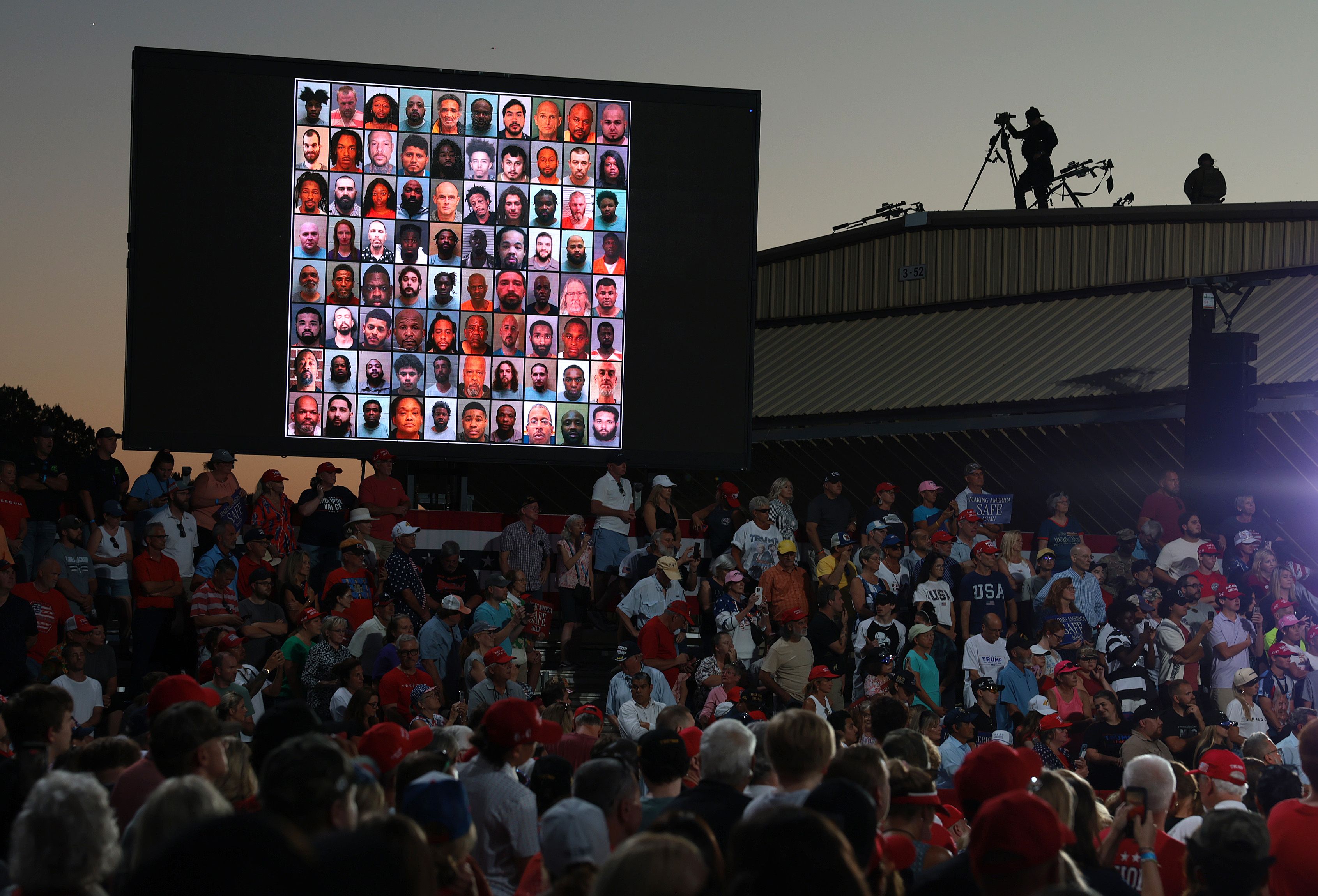 Images of criminals are displayed as U.S. President Donald Trump speaks during a campaign rally with North Carolina Republican Senate candidate and former RNC Chairman Michael Whatley at Gastonia Municipal Airport on September 16, 2026 in Gastonia, North Carolina.