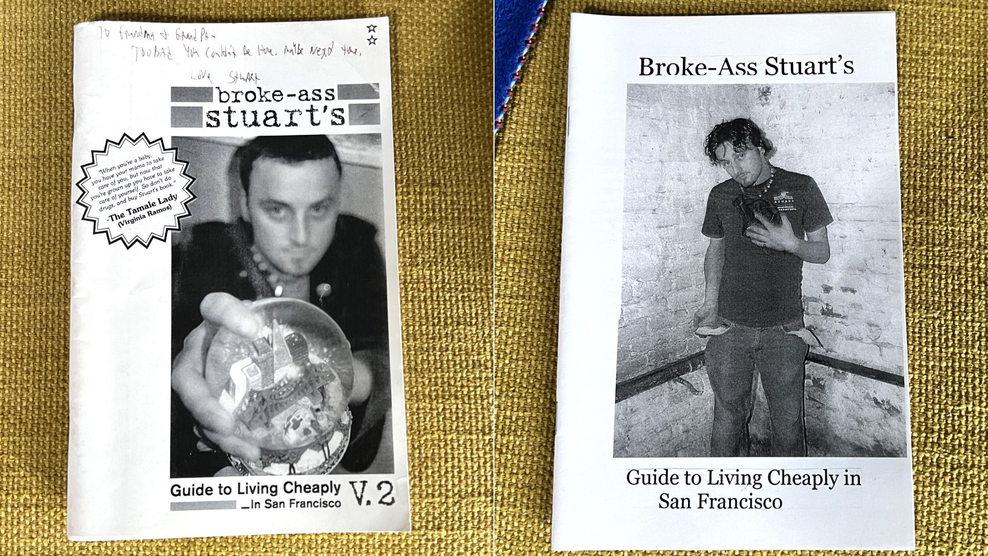 Two editions of "Broke-Ass Stuart's Guide to Living Cheaply in San Francisco" on a mustard yellow carpet, both with black-and-white photos of a man on the covers, one pointing at a snow globe.