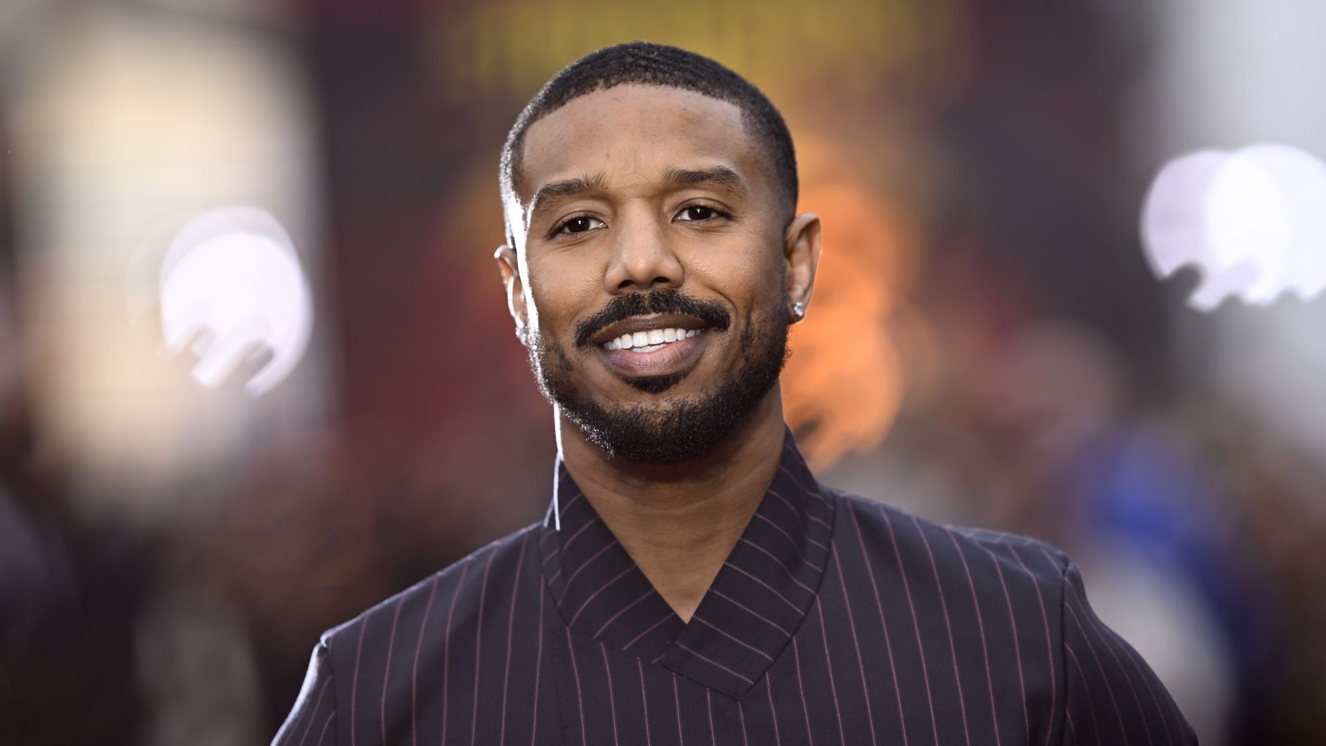 Photo shows Michael B. Jordan smiling.