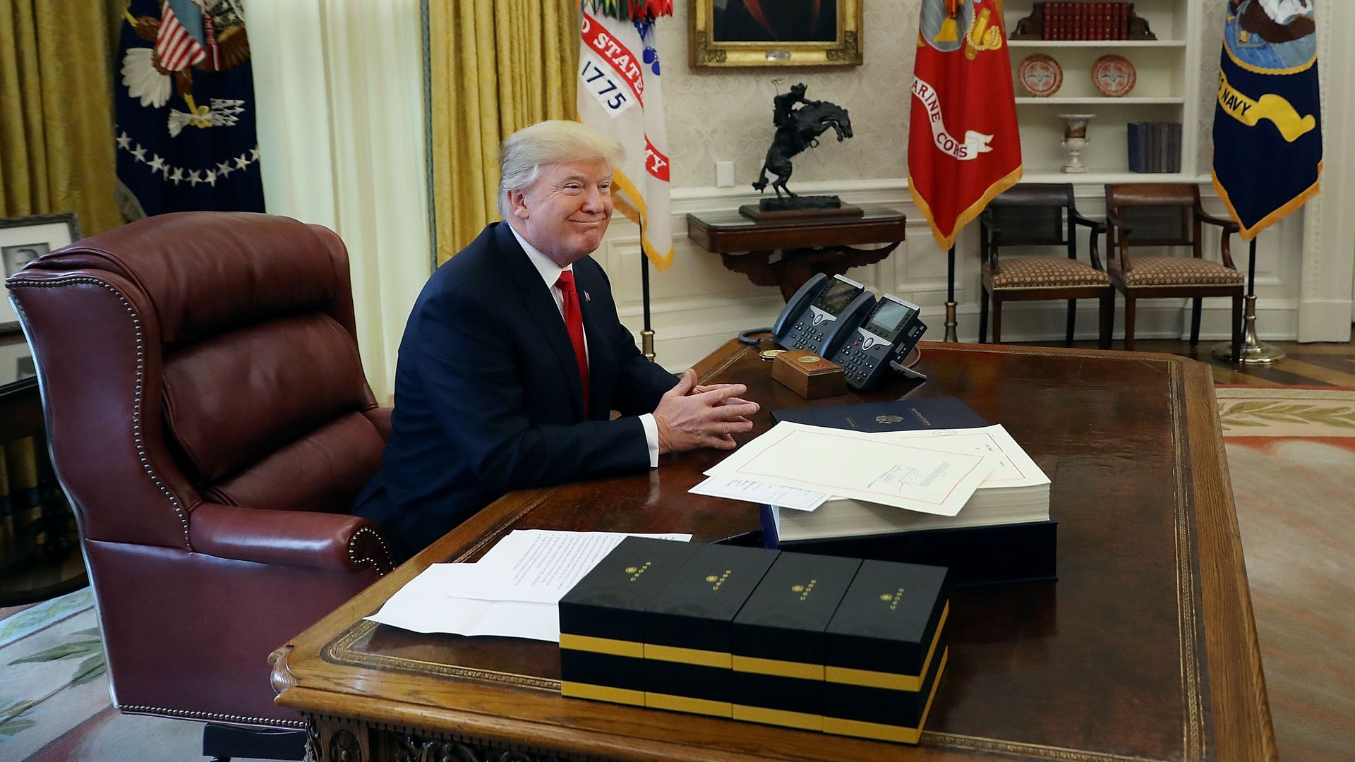 Trump smiles in the Oval Office