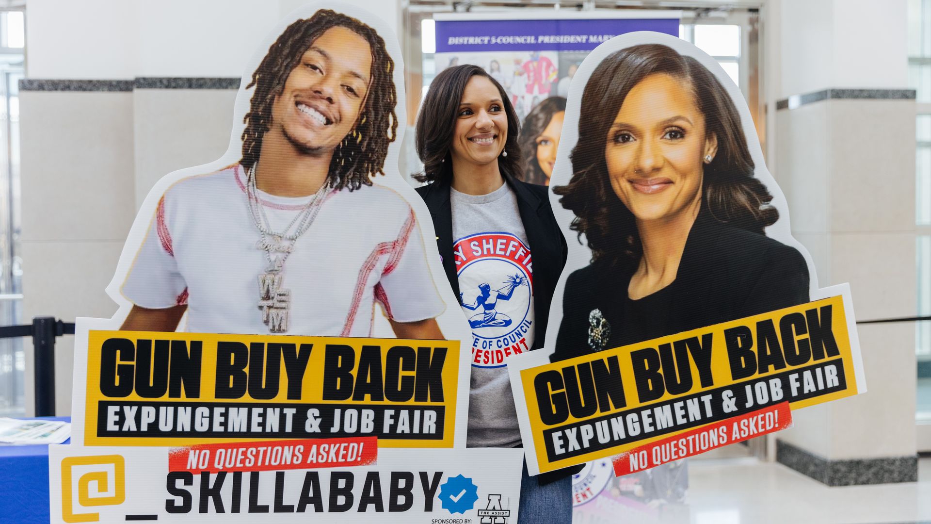 Council President Mary Sheffield with a cut out of rapper Skilla Baby at her gun buyback and job fair event at The Icon.