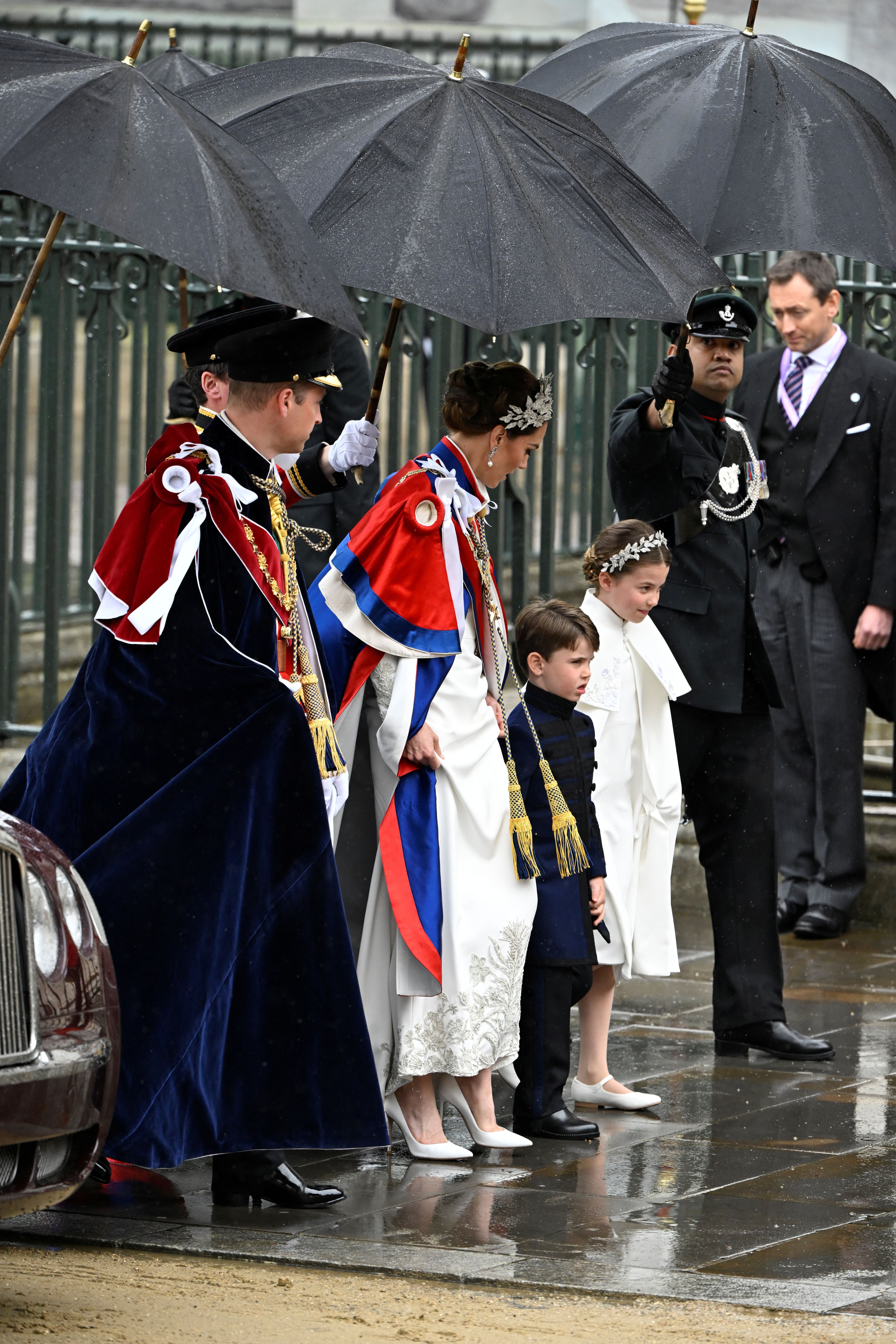 Prince William, Catherine, Princess of Wales, and their children Princess Charlottte and Prince Louis arrive at the Coronation of King Charles III 