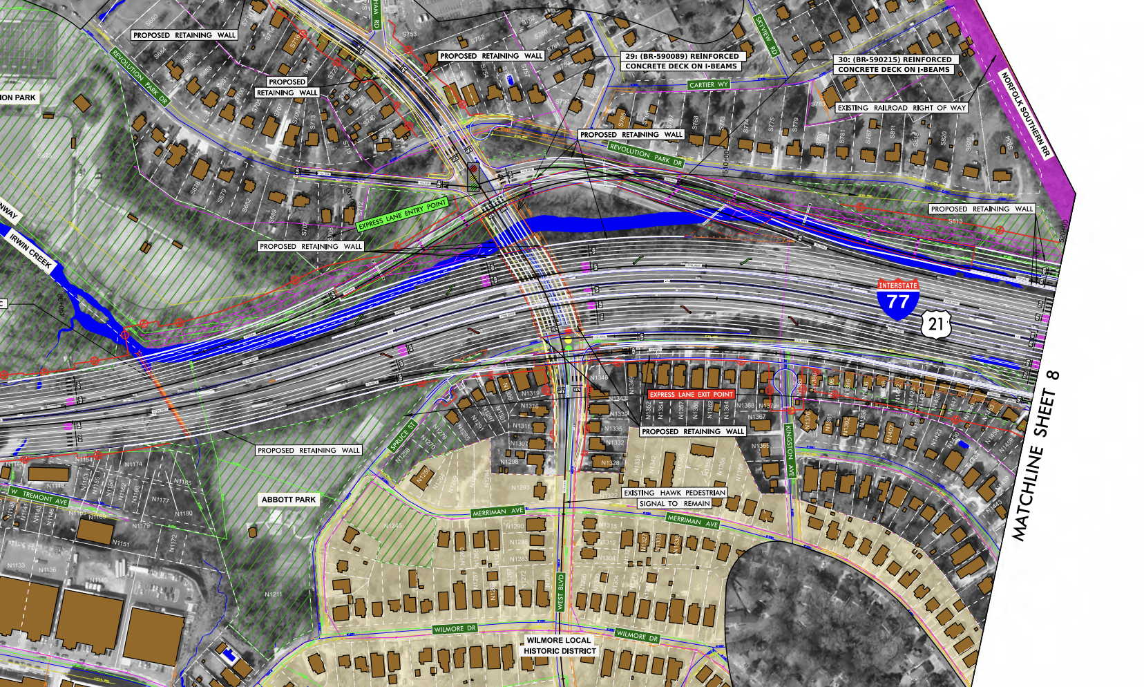 Detailed engineering map of a highway interchange and surrounding area, showing I-77 with multiple ramps, a blue river, green park areas, proposed retaining walls, and labeled streets and parcels.