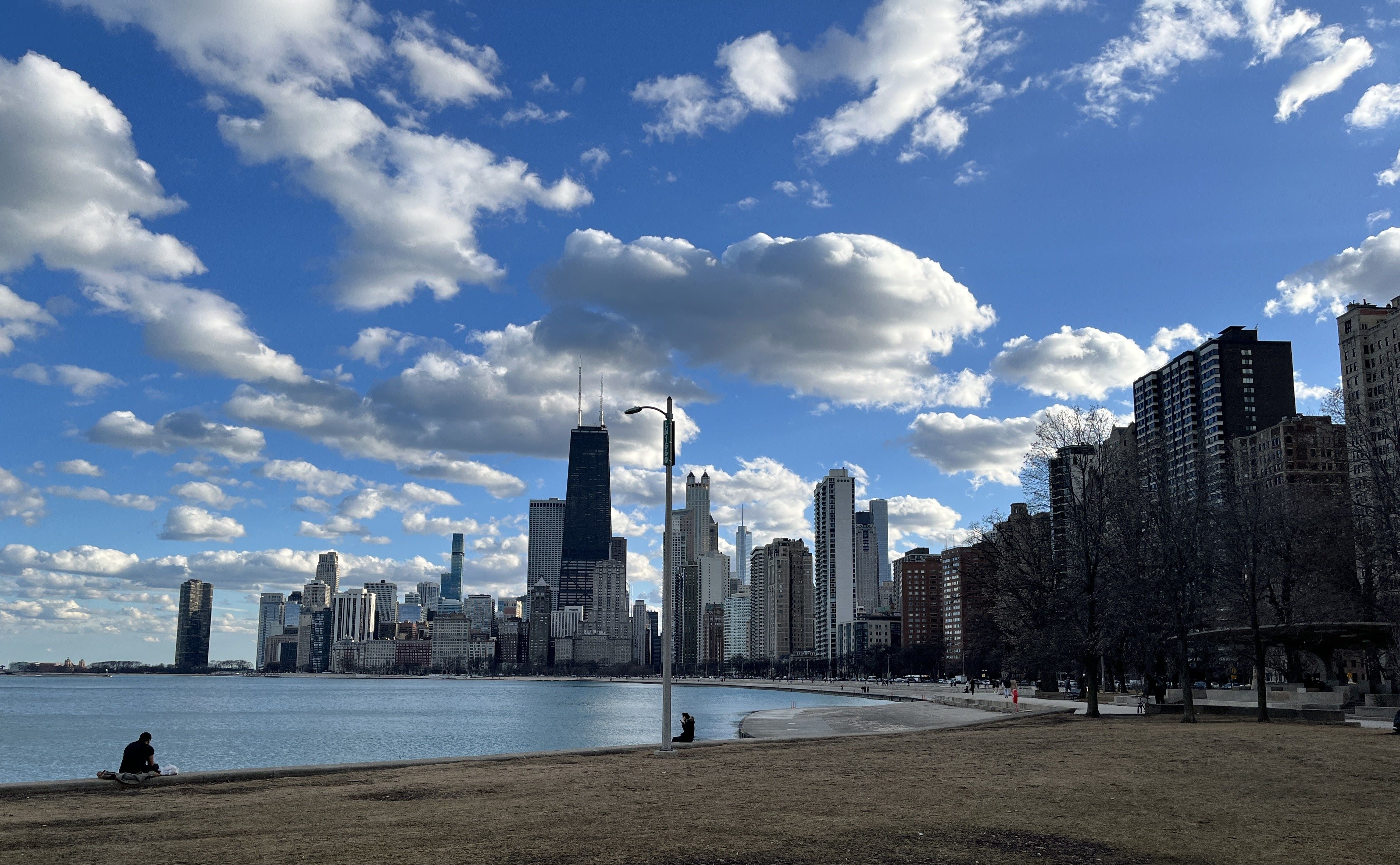 Photo of a skyline near a body of water. 