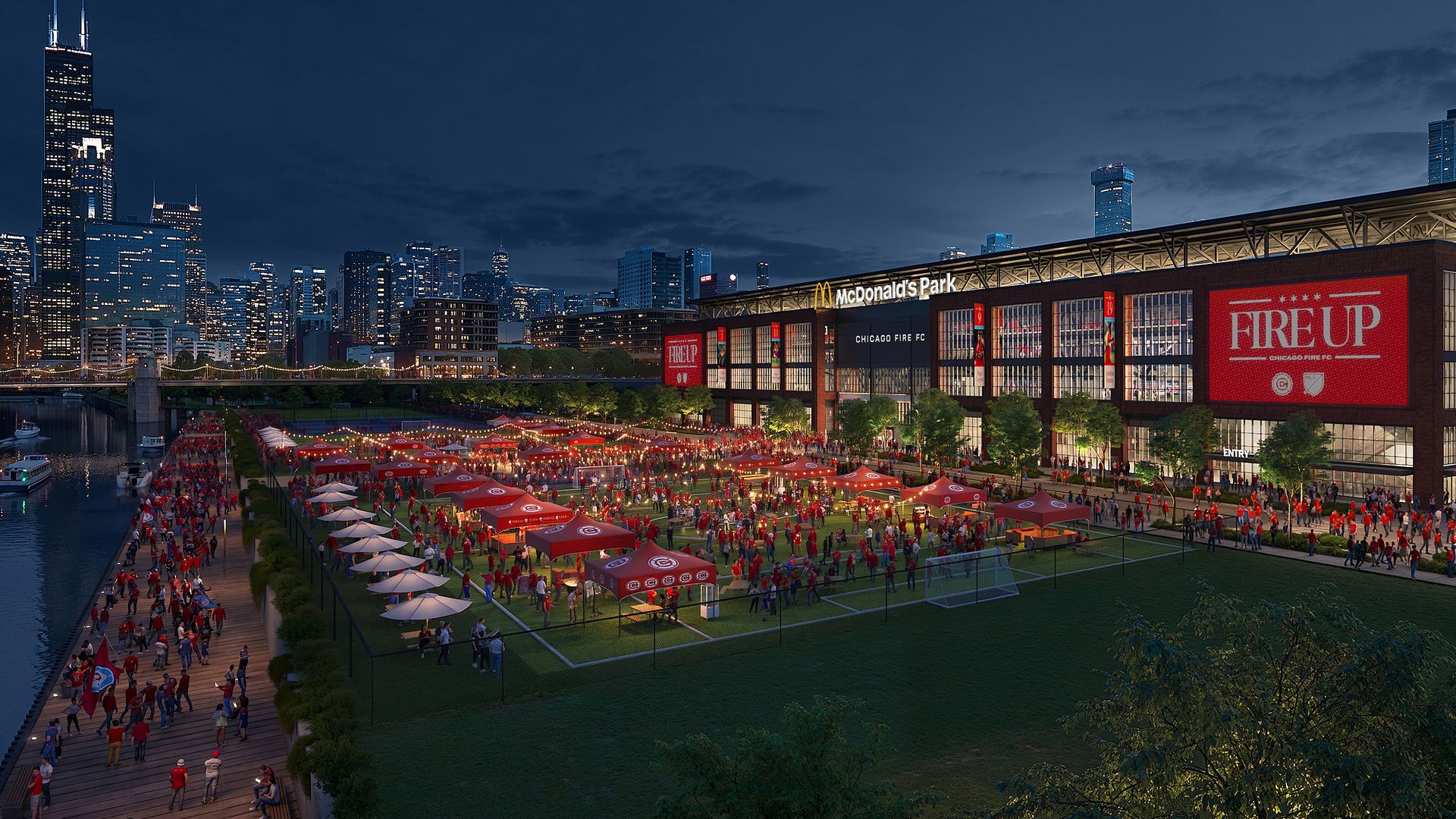 Evening cityscape featuring a riverside stadium filled with a red-clad crowd; Chicago skyline with a tall twin-spired building on the left and a deep blue dusk sky.